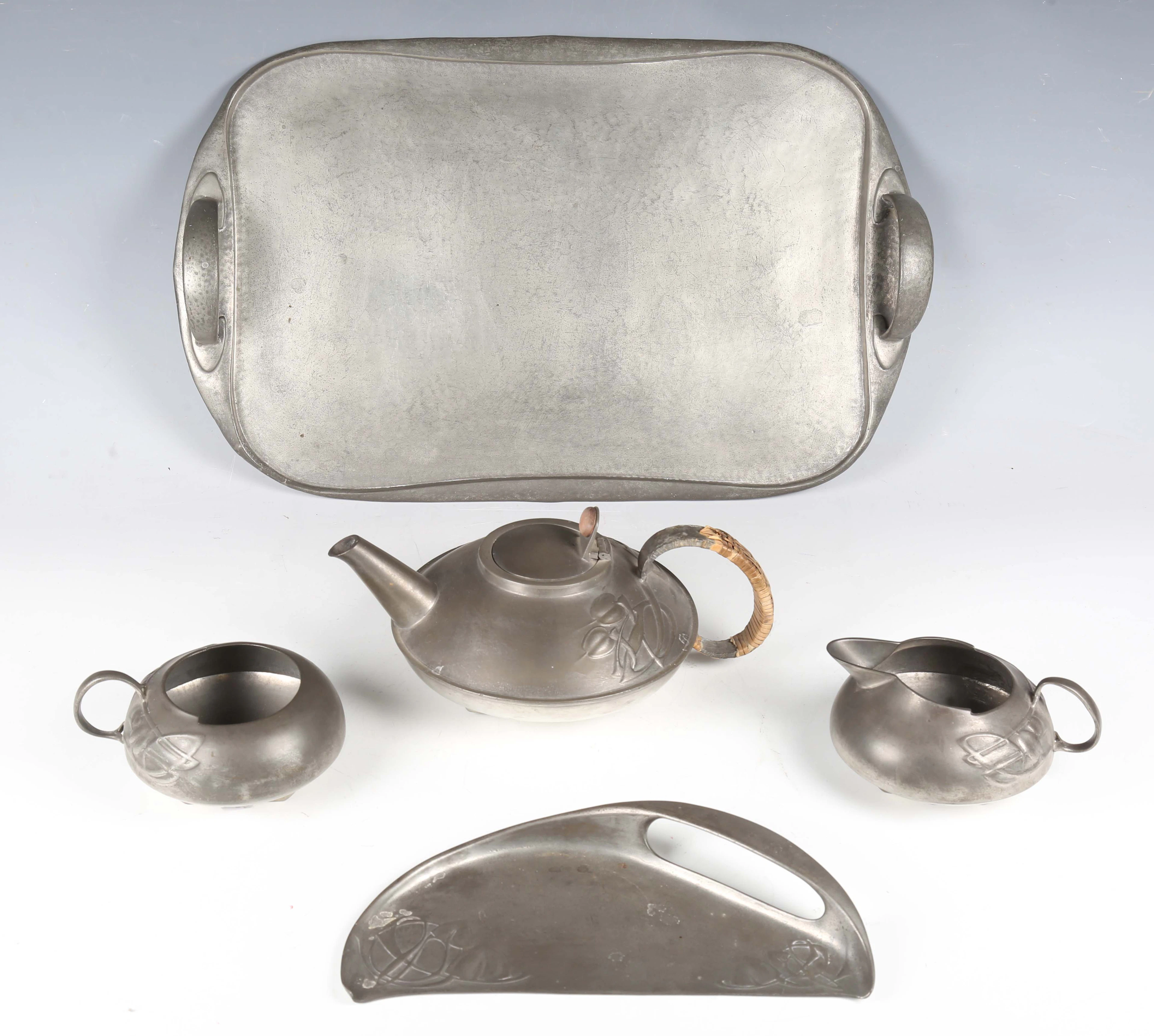 A Liberty & Co 'Tudric' pewter three-piece tea set, designed by Archibald
