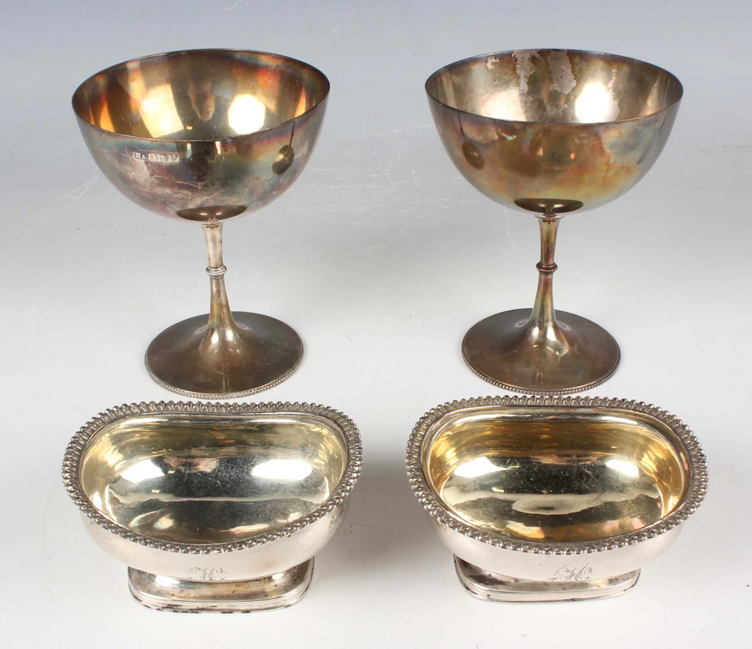 A pair of George III silver salts, each of oval boat shaped form with