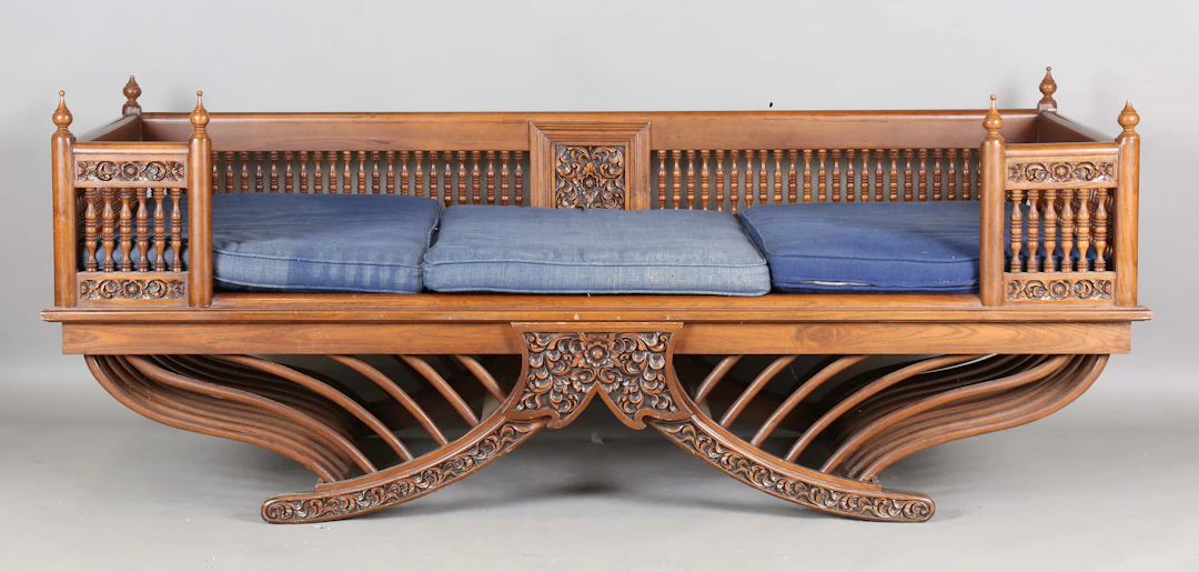 A late 20th century Thai hardwood daybed in the form of an elephant