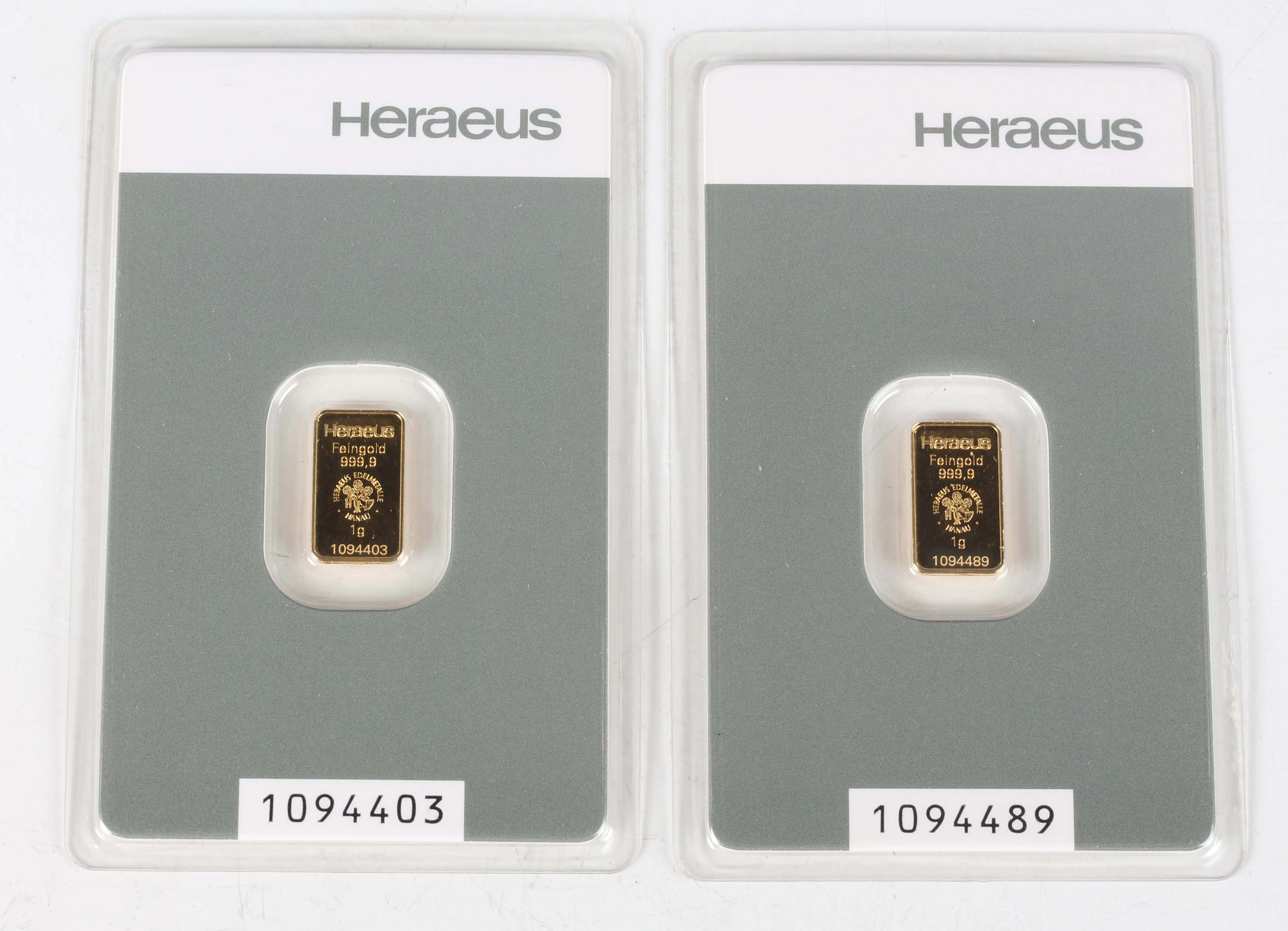 Two Switzerland Heraeus gold one gram ingots, each within a soft slab