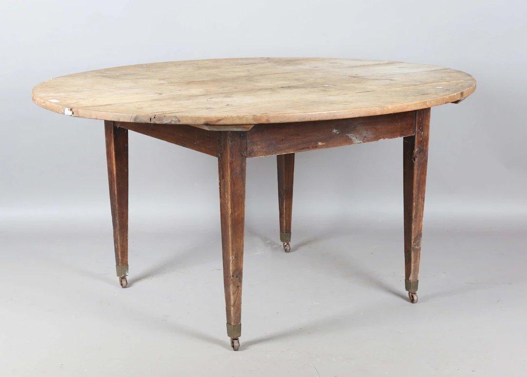 A 19th century pine oval farmhouse dining table, fitted with a single