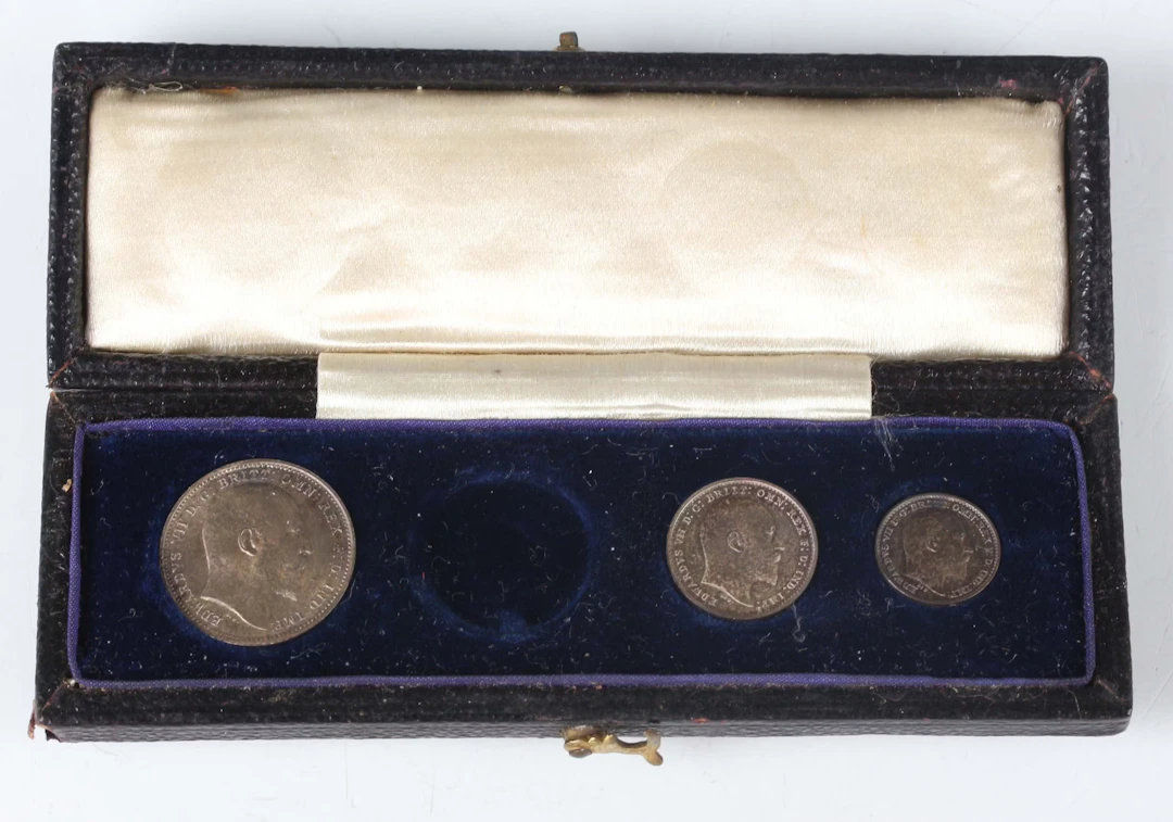 An Edward VII Maundy coin part-set 1907 (lacking threepence), with