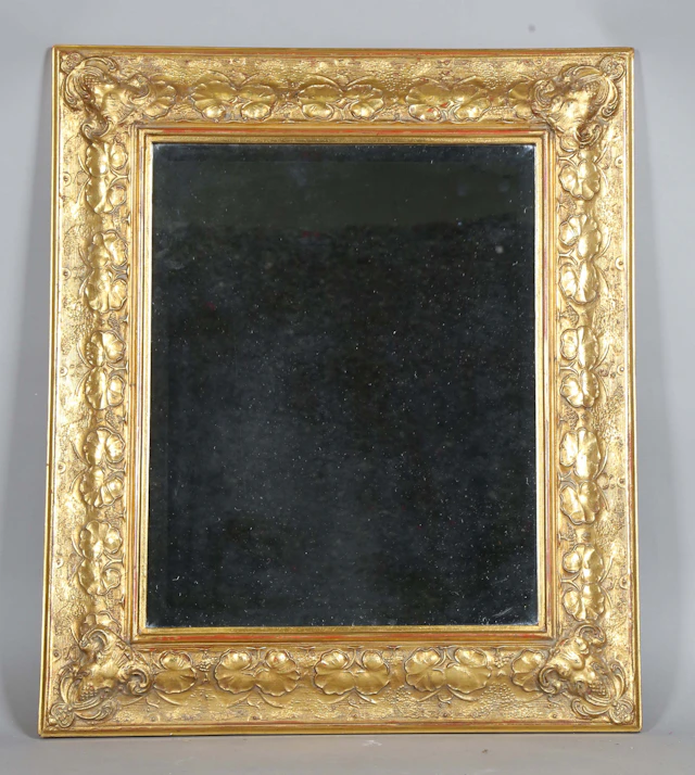 A late 20th century gilt composition rectangular wall mirror, the