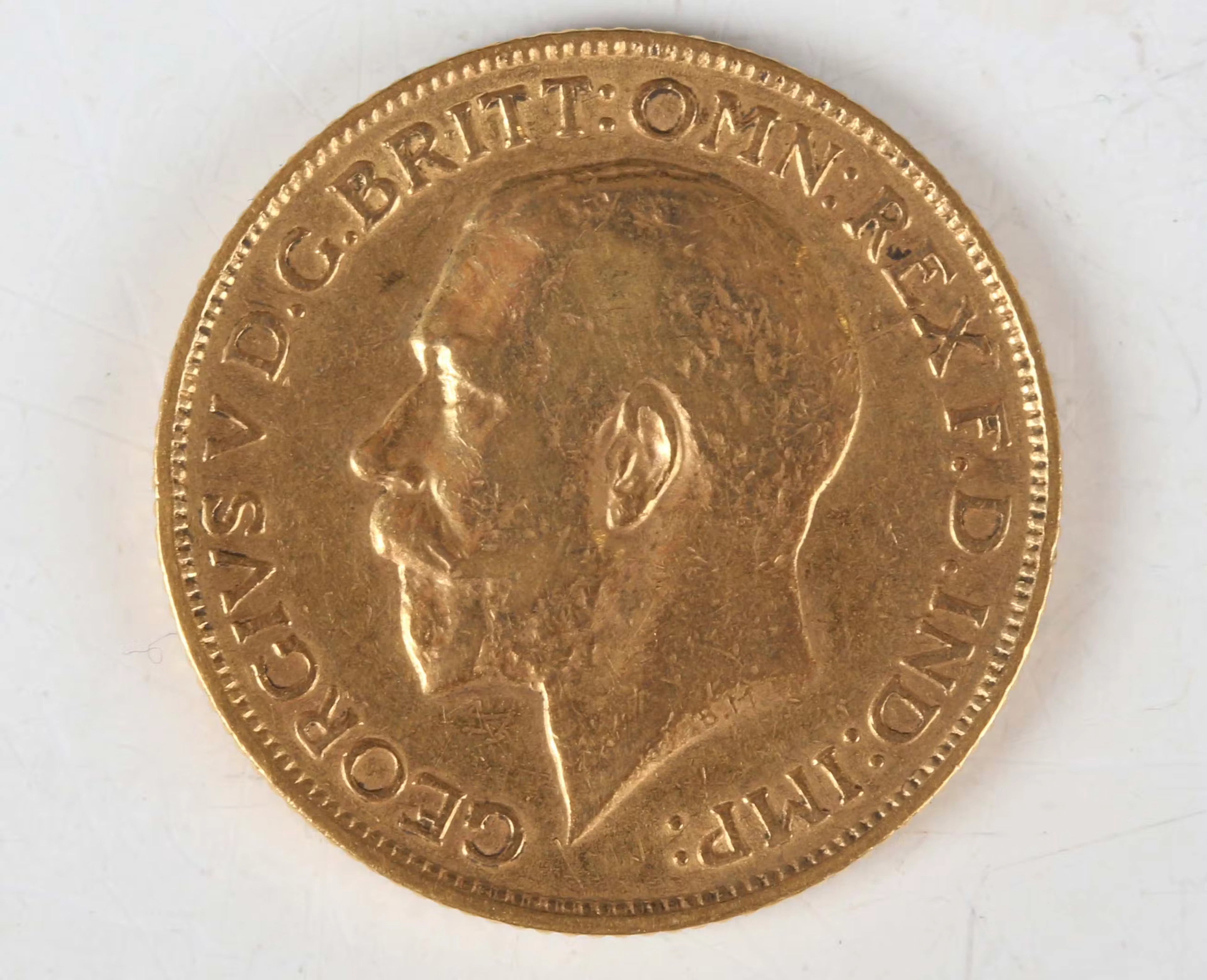 A George V sovereign 1912. Note: this lot includes an HMRC classified