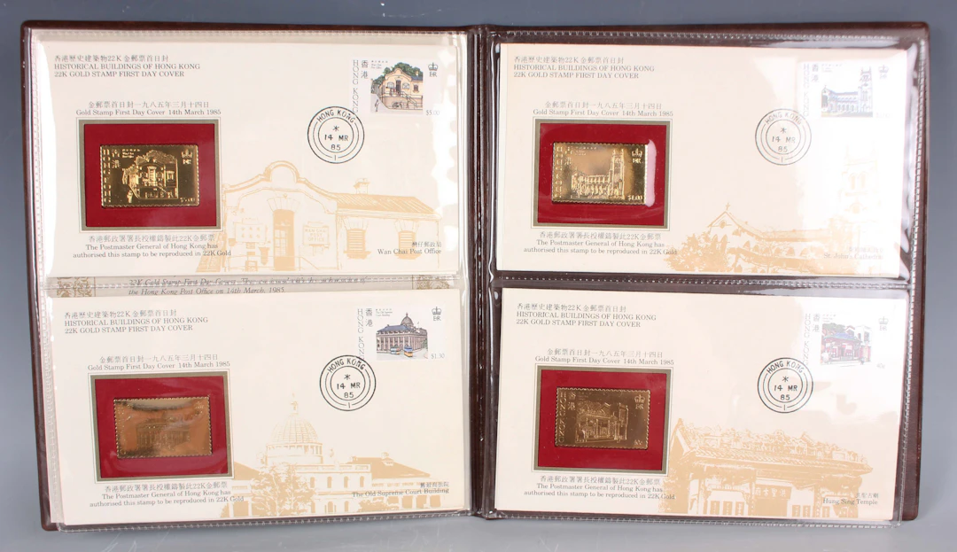A set of four International Collections 22ct gold stamp replica ingots