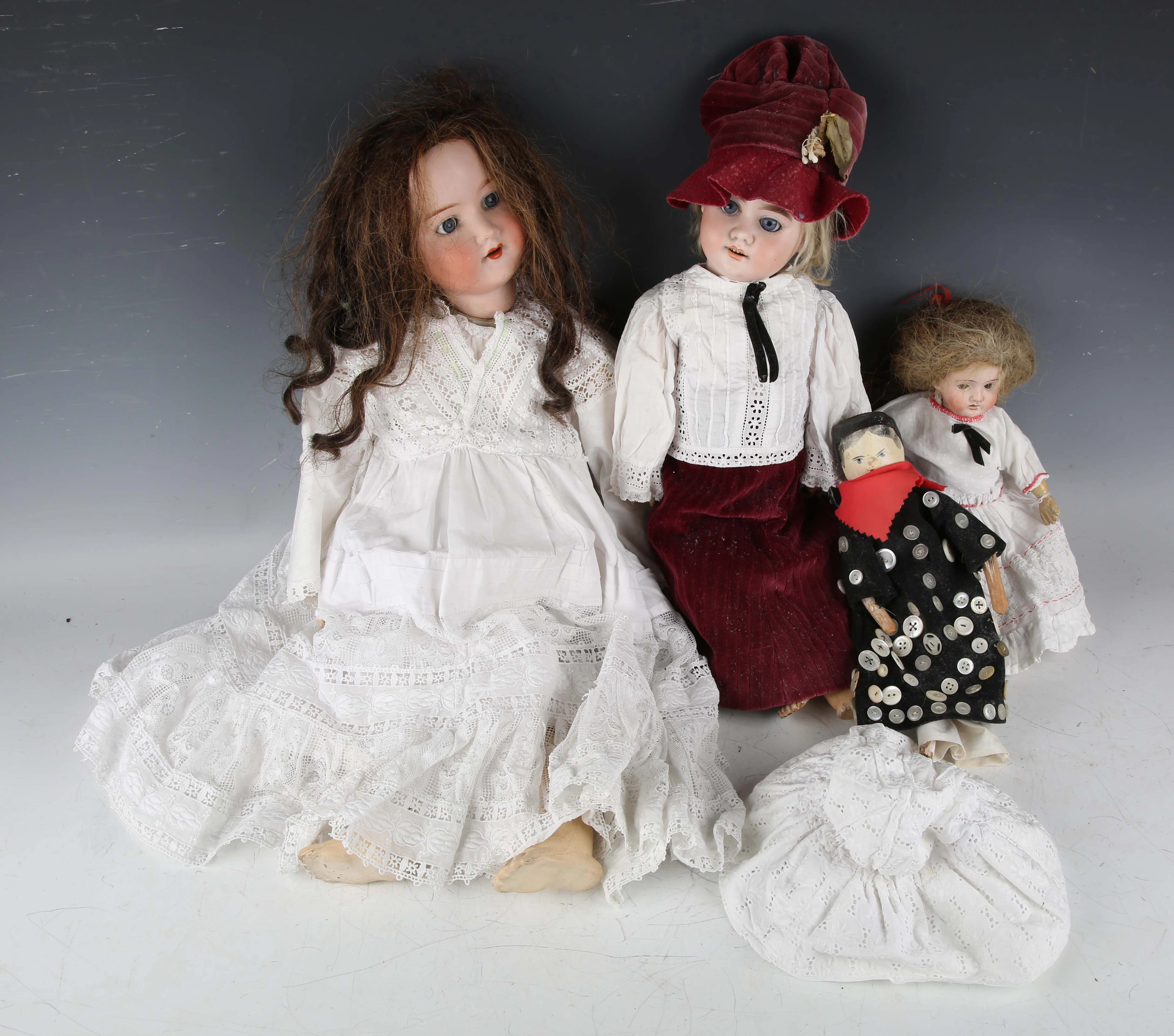 Three bisque head dolls, comprising Armand Marseille, impressed '390