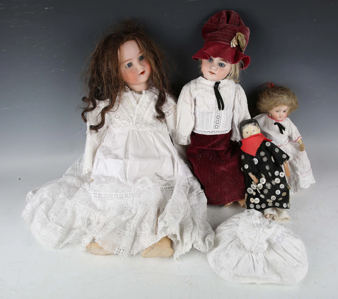 Three bisque head dolls, comprising Armand Marseille, impressed '390