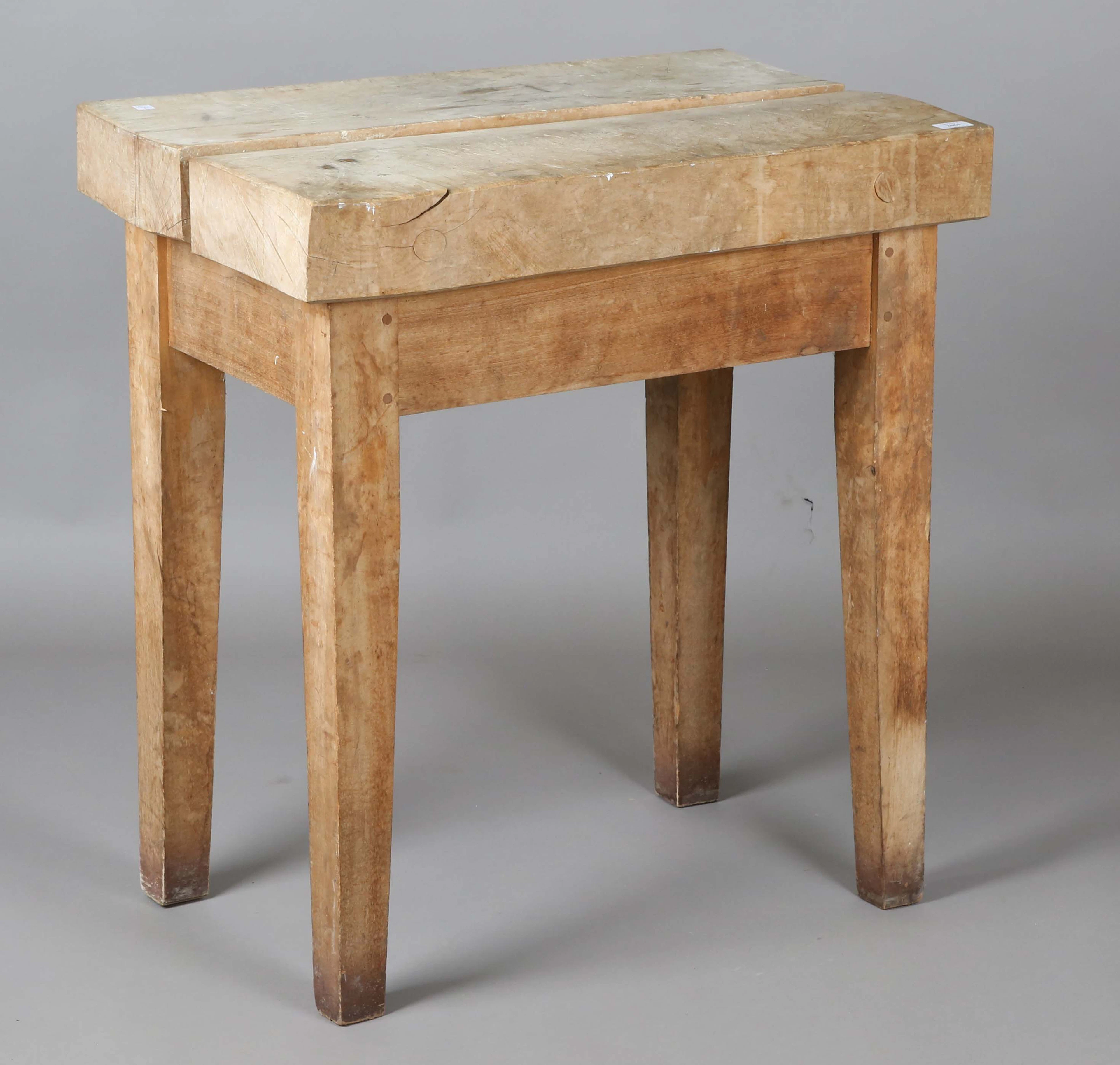 An early 20th century beech butcher's block, on block legs, height