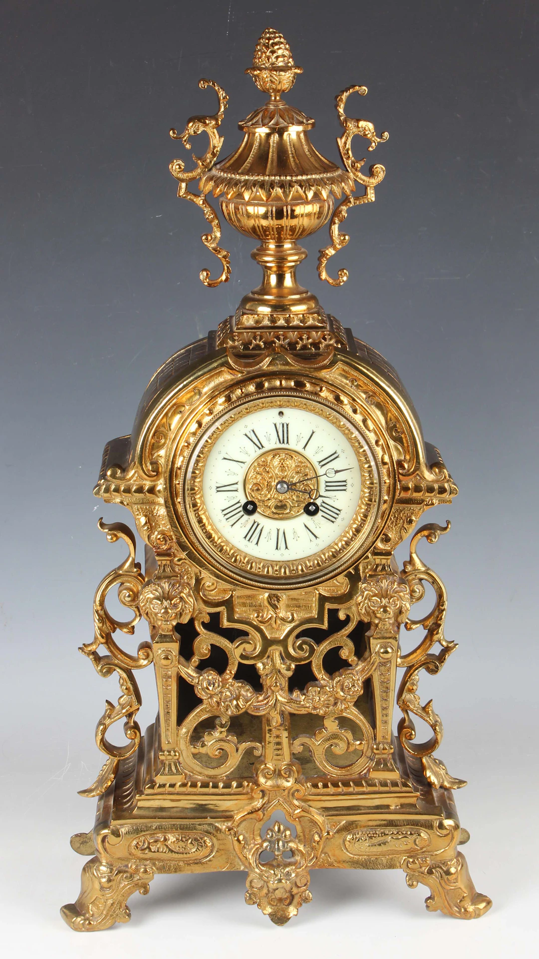 A late 19th century gilt brass cased mantel clock with eight day movement