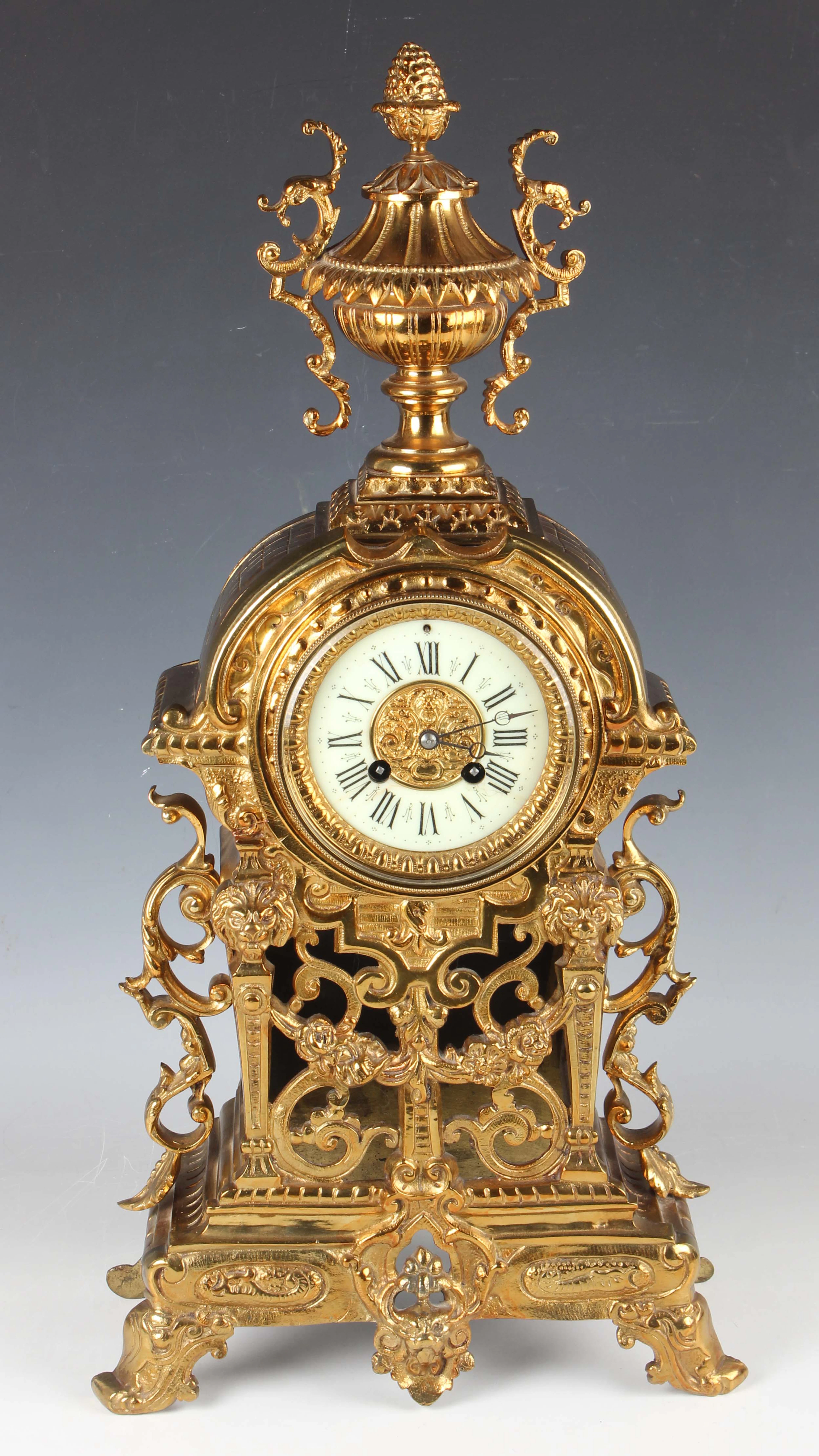 A late 19th century gilt brass cased mantel clock with eight day movement
