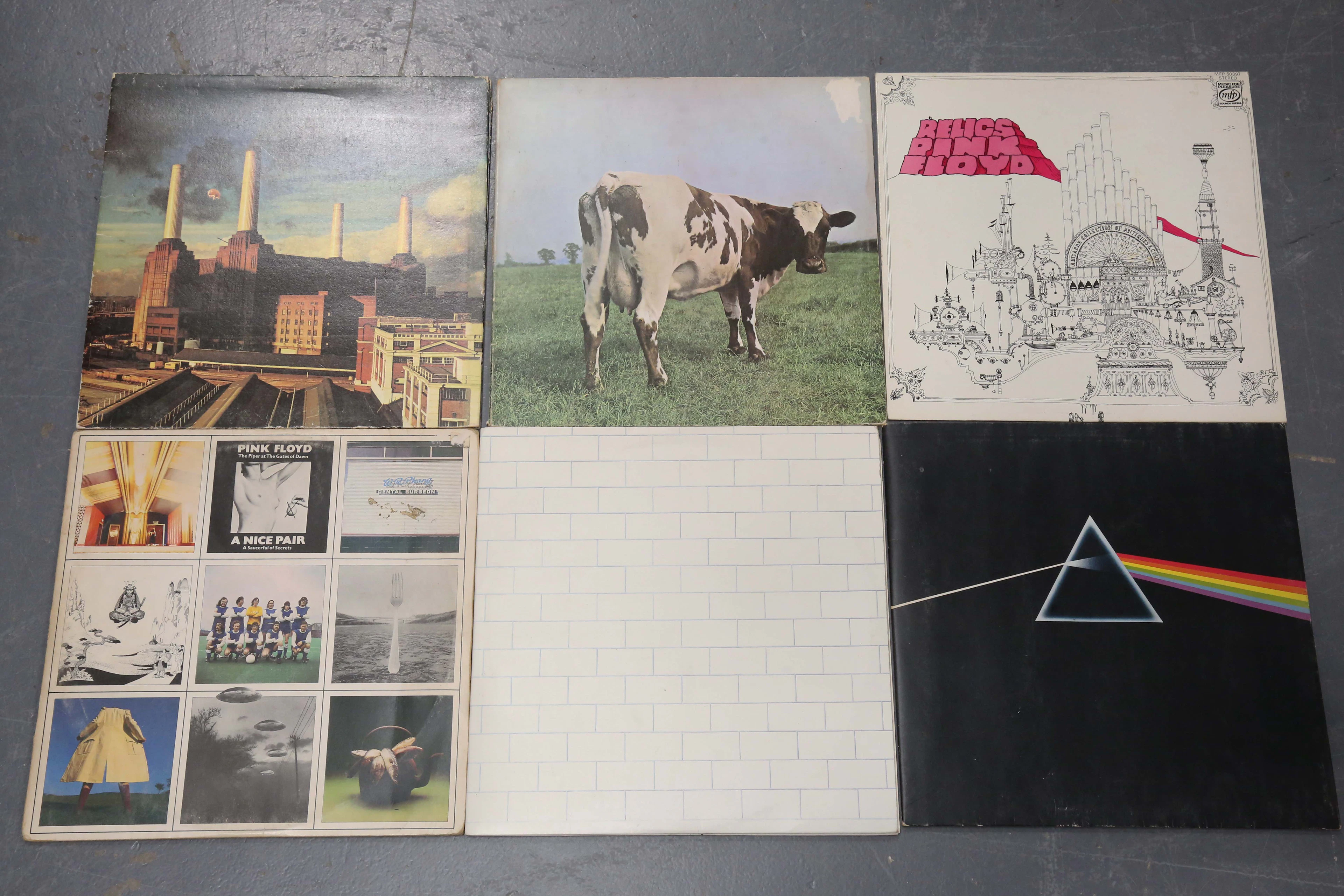 A small collection of LP records by Pink Floyd, including a Canadian