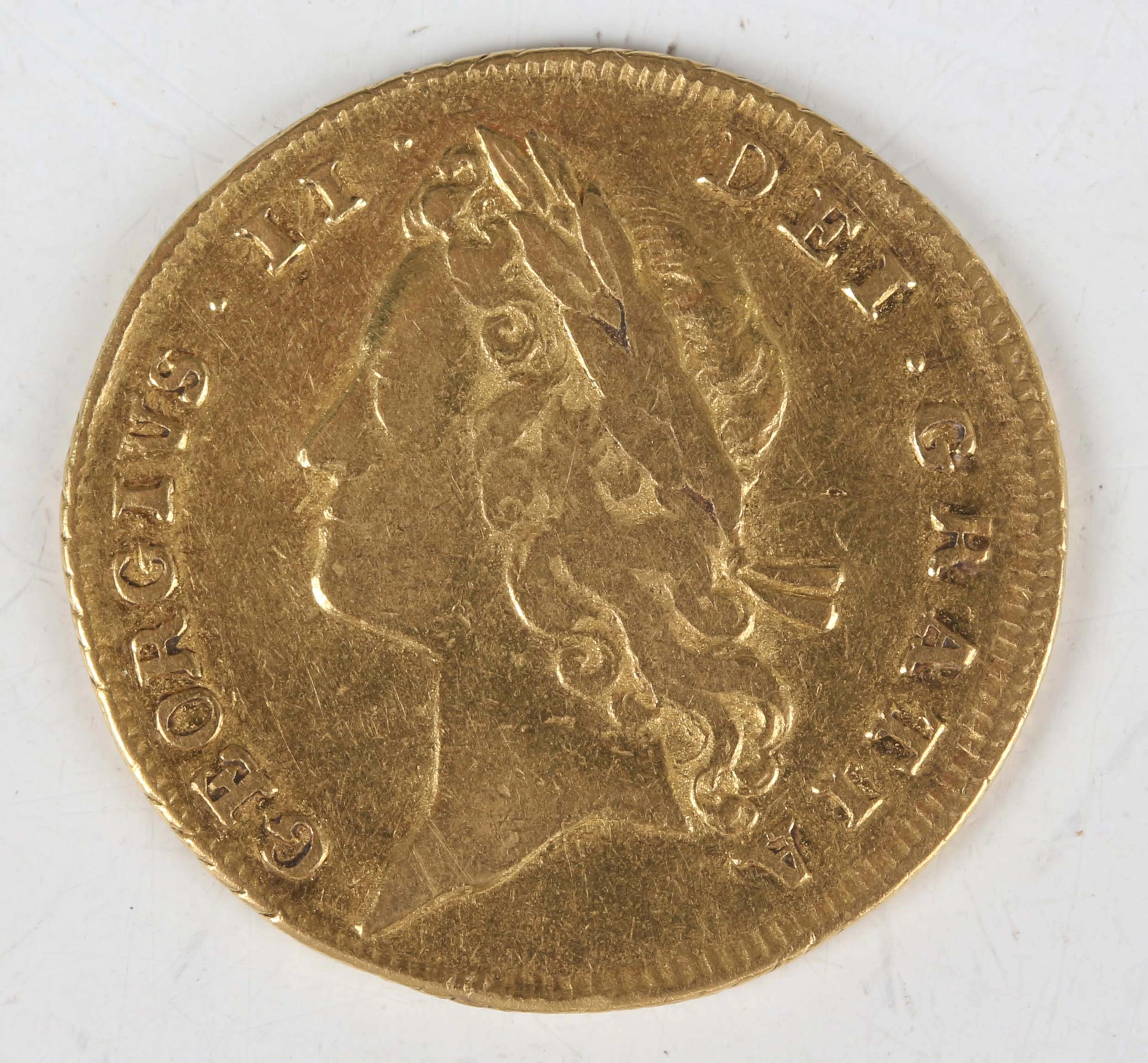 A scarce George II guinea 1732, young laureate head, Sp 3672 (good/fine).