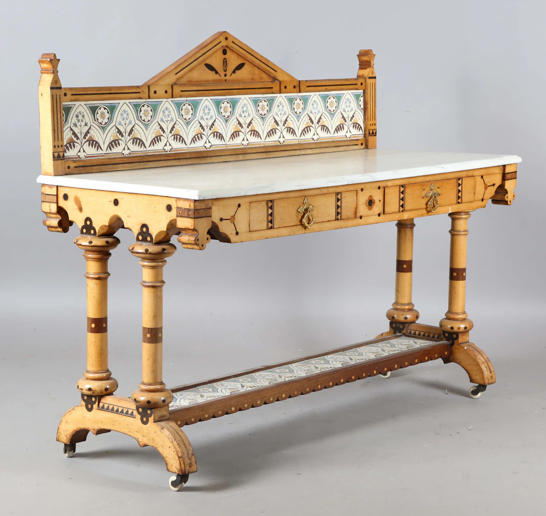 A late Victorian Aesthetic Movement inlaid maple washstand, the design