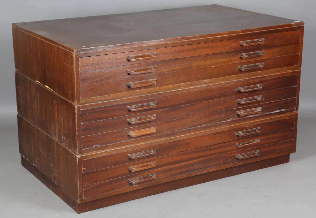 A mid-20th century walnut planner's or folio chest of nine drawers