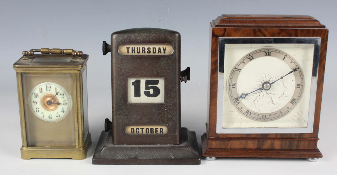 A mid-20th century walnut cased mantel timepiece, the dial detailed