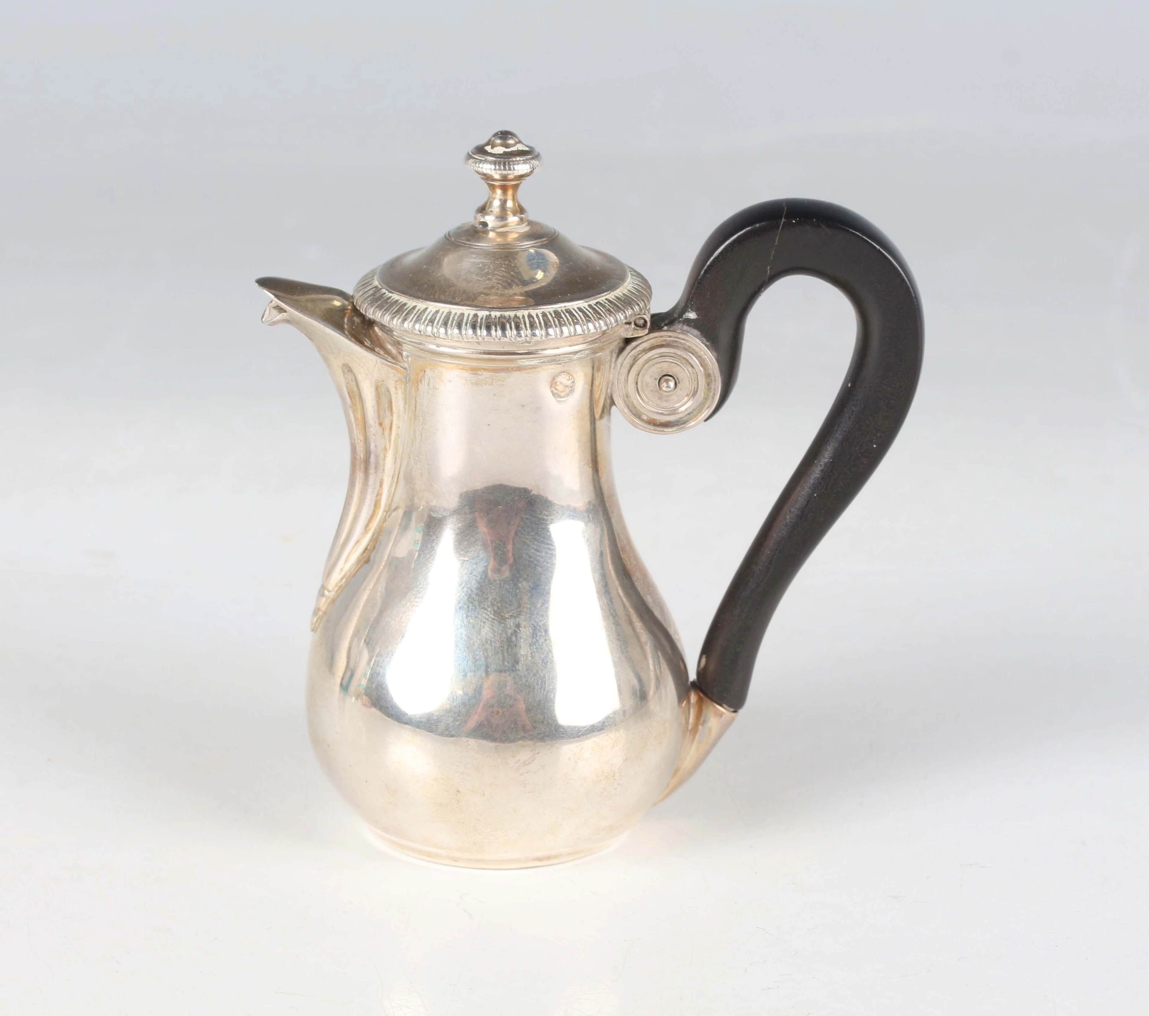 An early 19th century French miniature toy silver coffee pot of baluster