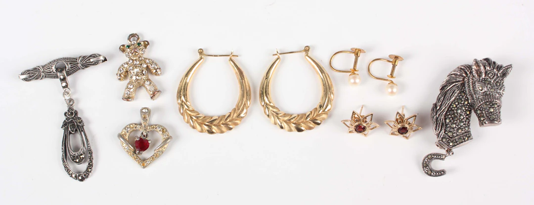 A pair of gold hoop shaped earrings, detailed ‘14K’, weight 2.2g