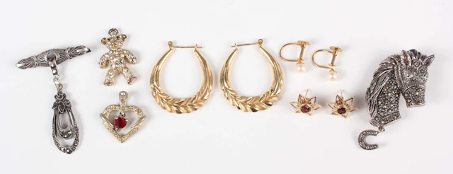 A pair of gold hoop shaped earrings, detailed ‘14K’, weight 2.2g