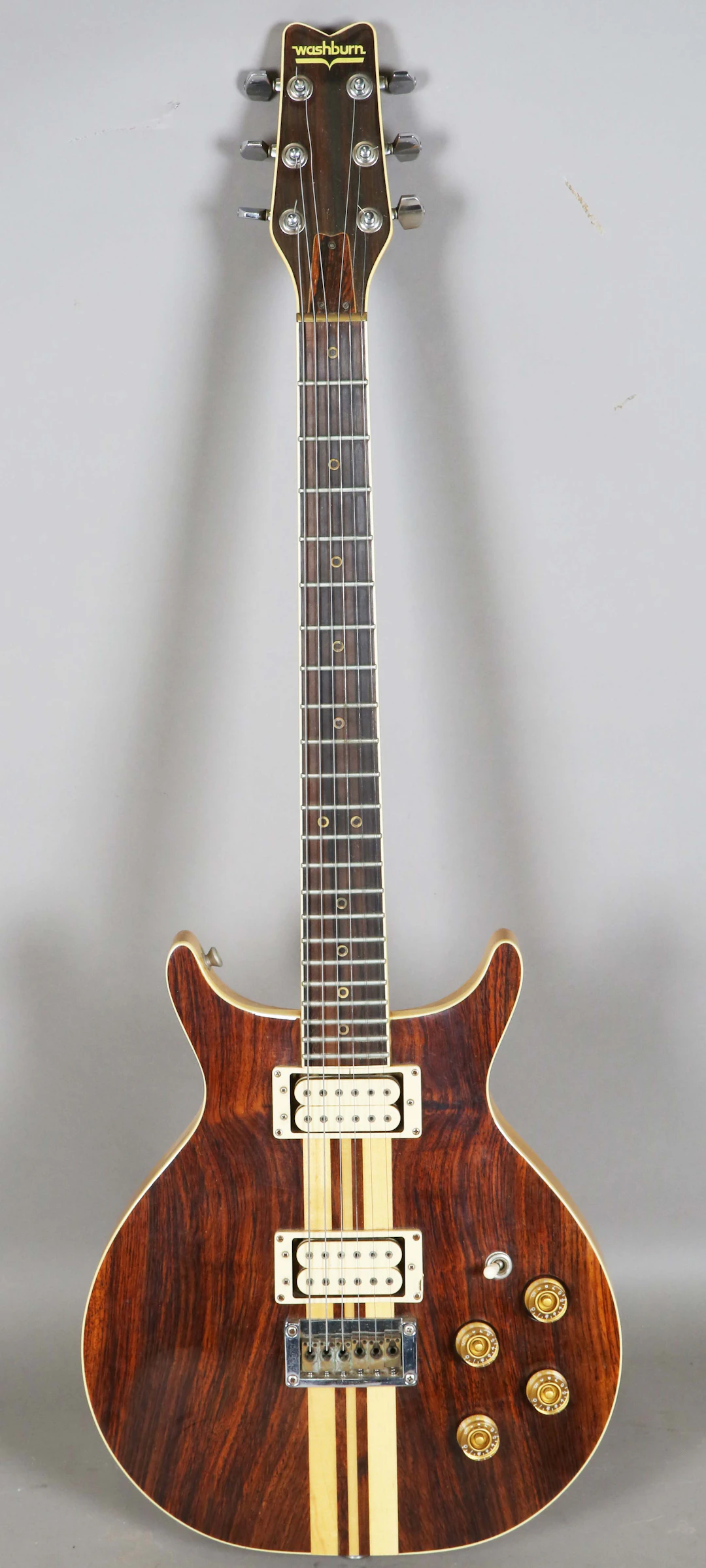 A Washburn solid body electric guitar with Indian rosewood front