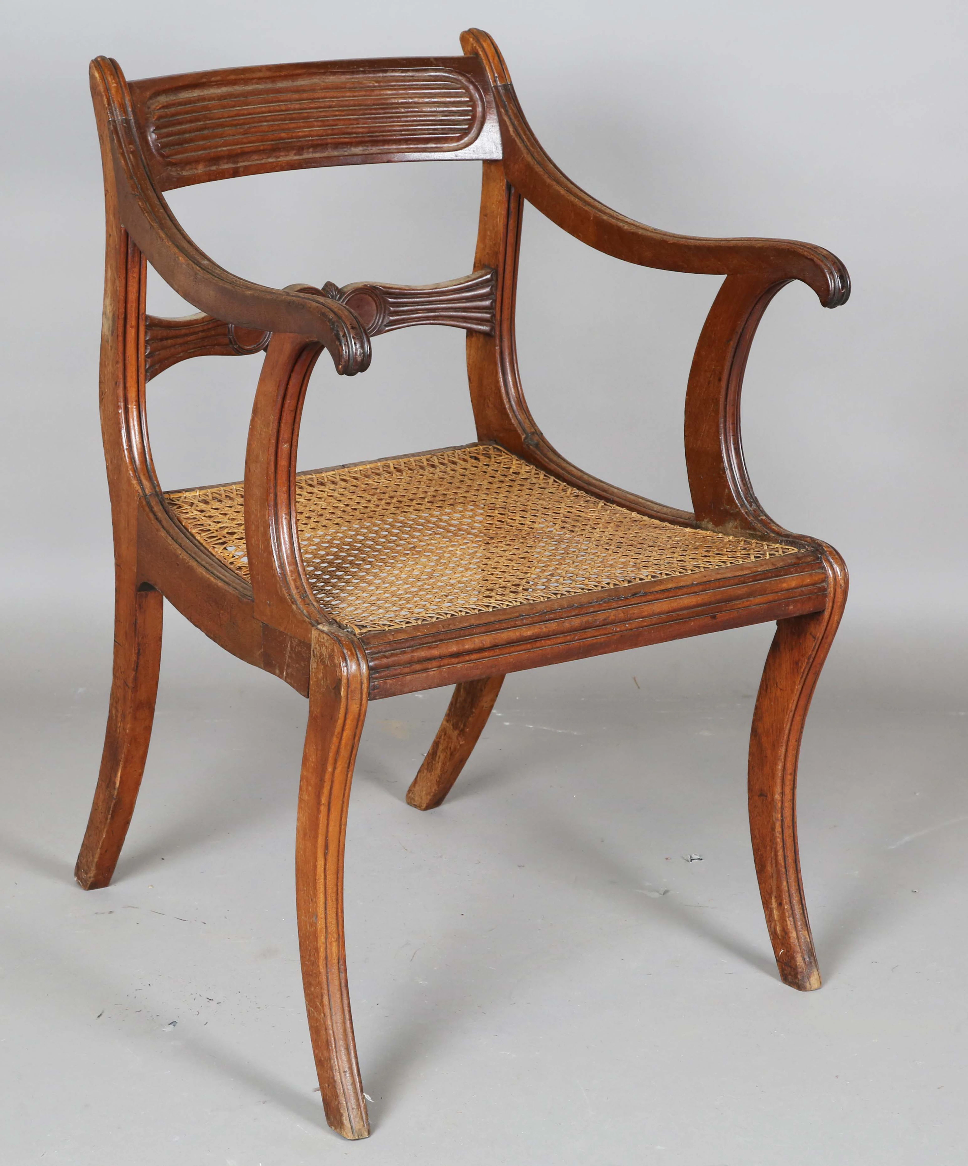 A Regency mahogany bar back elbow chair with a caned seat, height