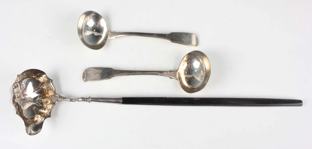 A pair of George III silver Fiddle pattern sauce ladles, London 1816