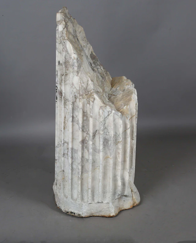 A monumental carved marble architectural column fragment, probably
