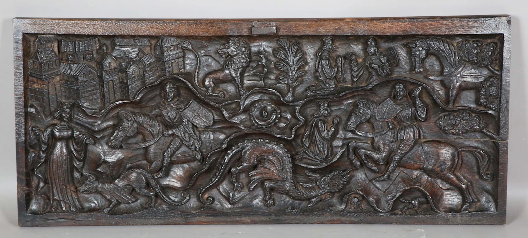 A 16th/17th century carved oak rectangular panel, well-worked in high