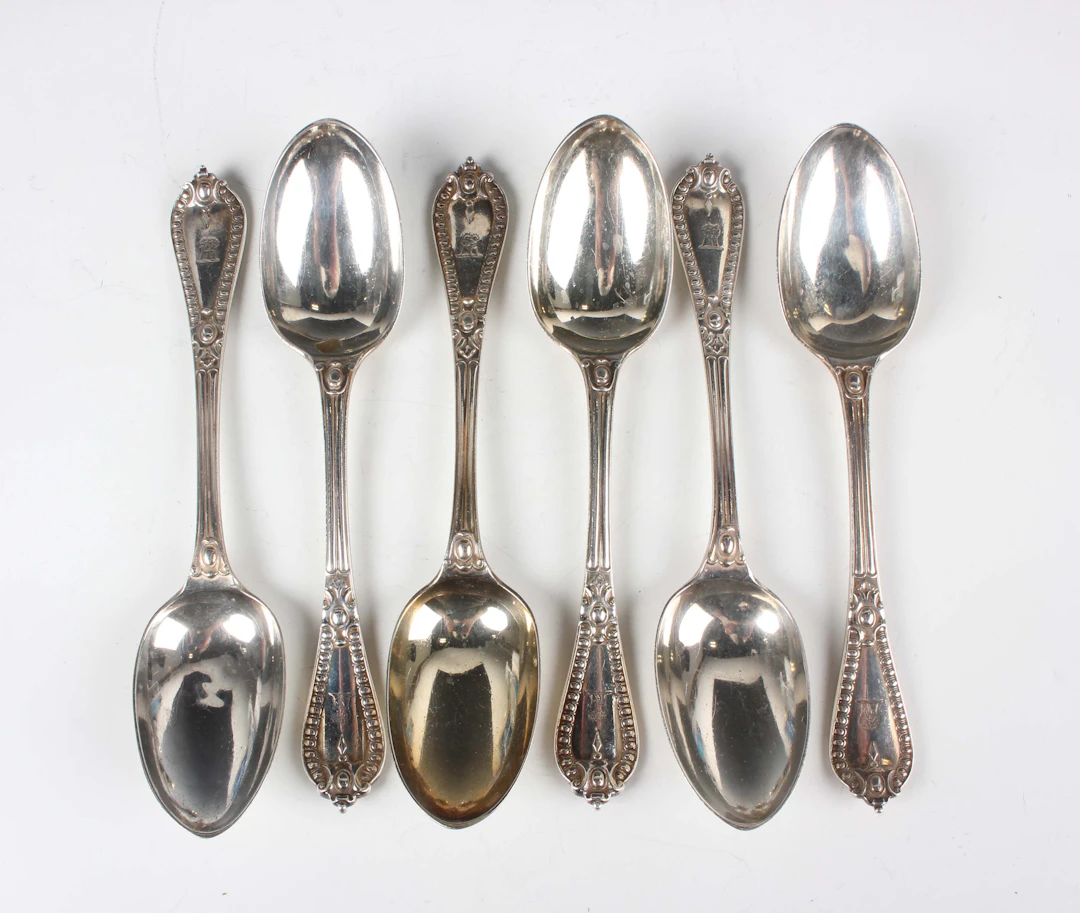 A set of six Victorian silver Grecian pattern dessert spoons, London