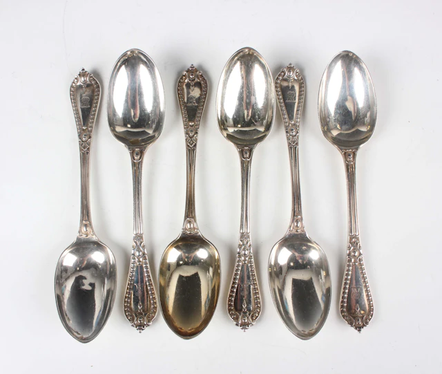 A set of six Victorian silver Grecian pattern dessert spoons, London