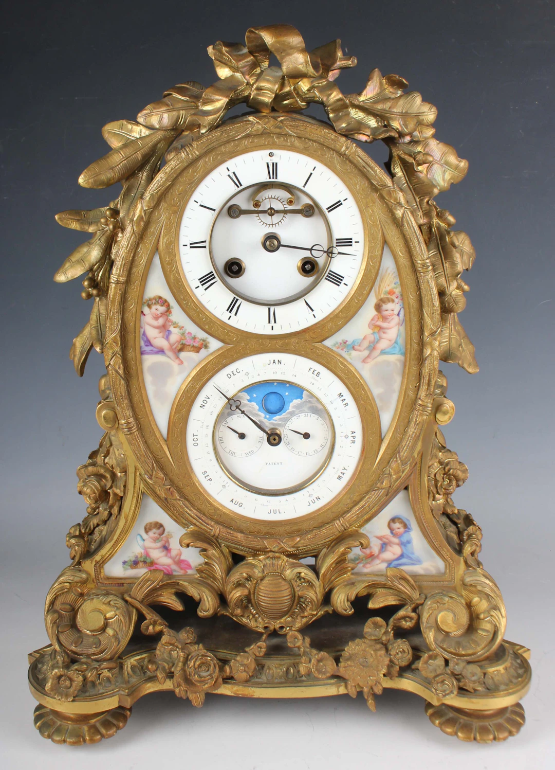 A late 19th century French ormolu and porcelain perpetual calendar