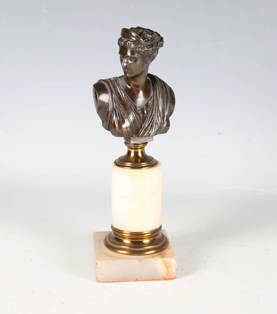 A late 19th century Continental cast bronze bust of Diana, raised