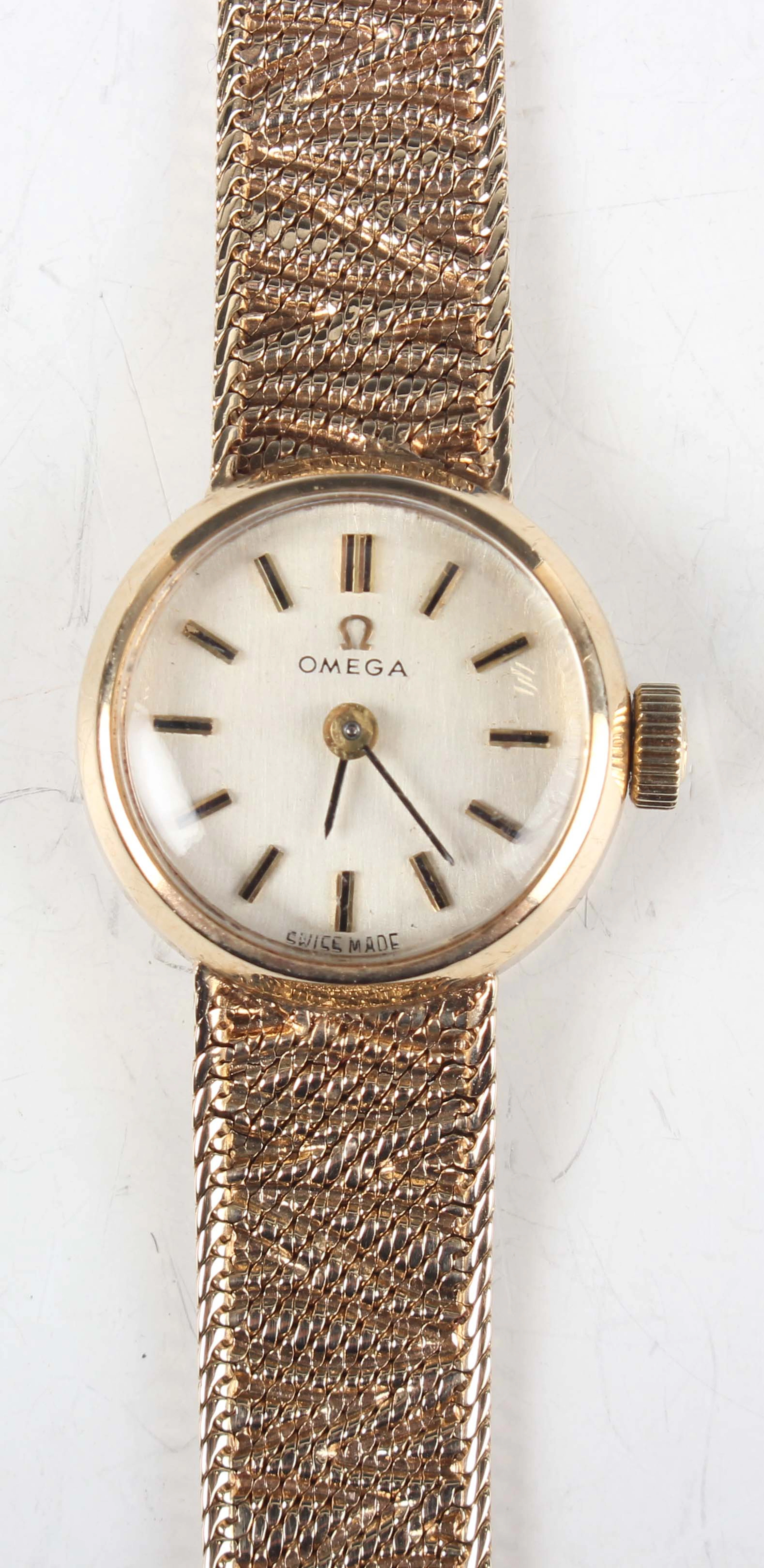 An Omega 9ct gold circular cased lady's bracelet wristwatch with signed
