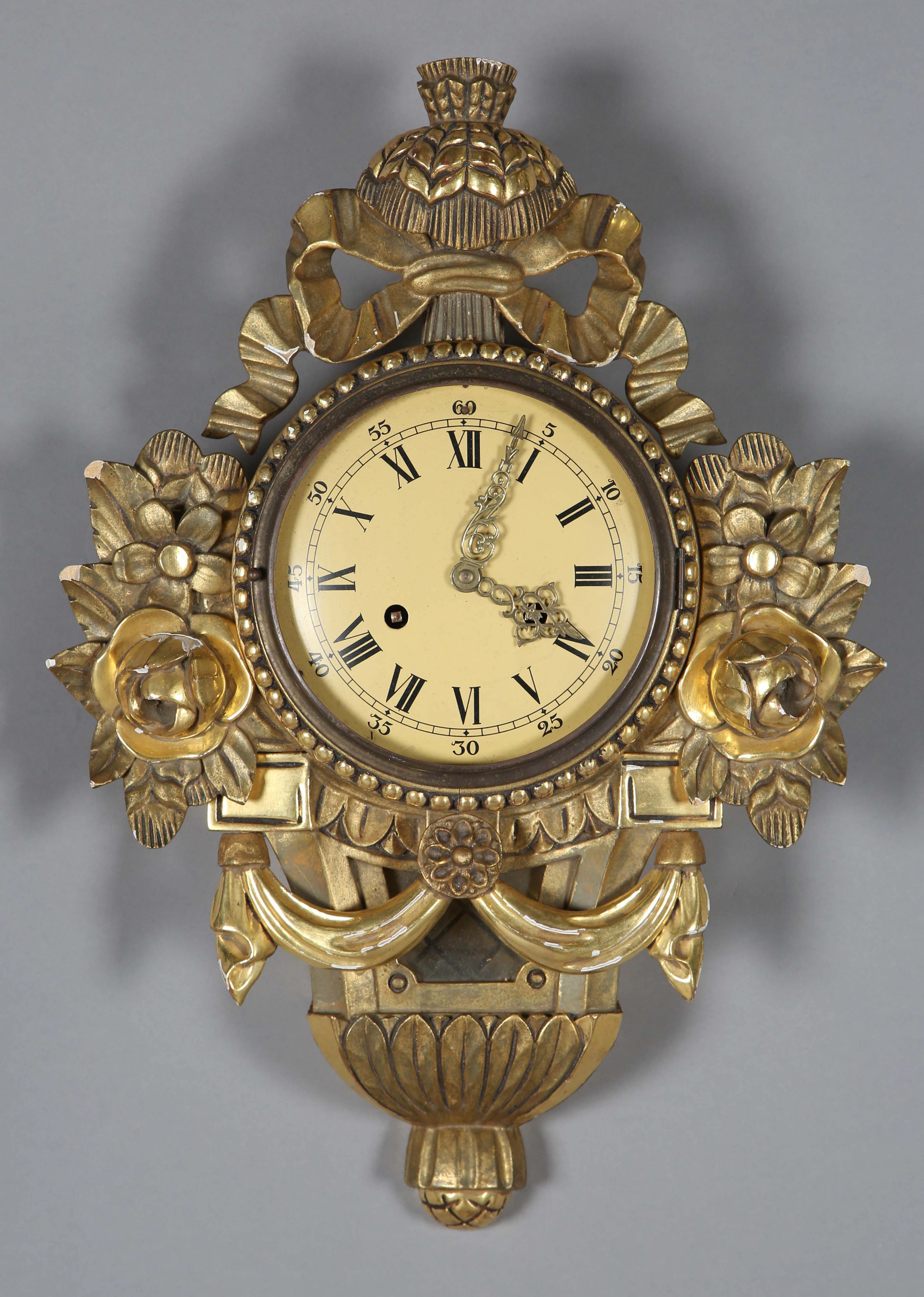 A 20th century Continental giltwood and gesso cased cartel clock with