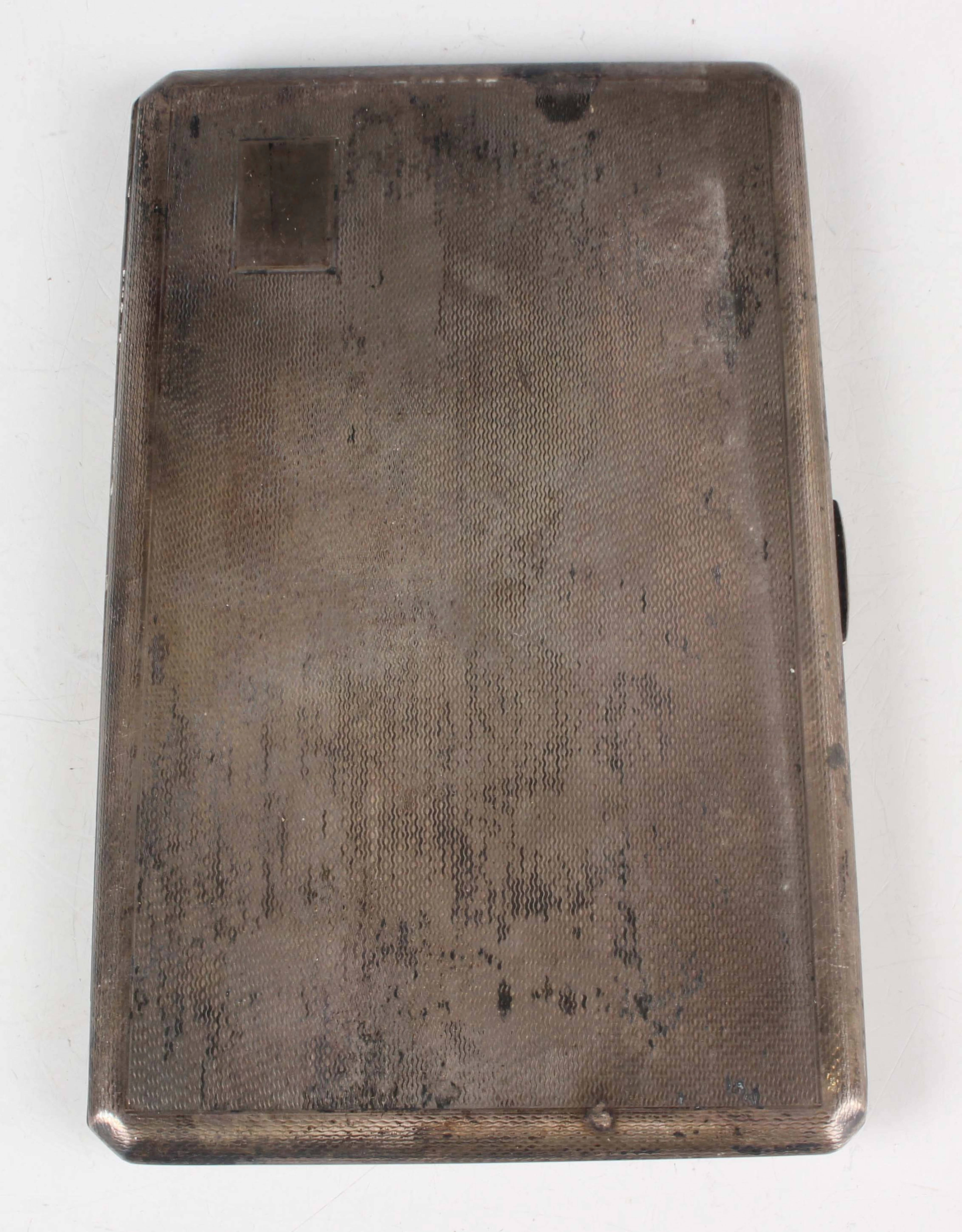 An Elizabeth II silver rectangular cigarette case with engine turned