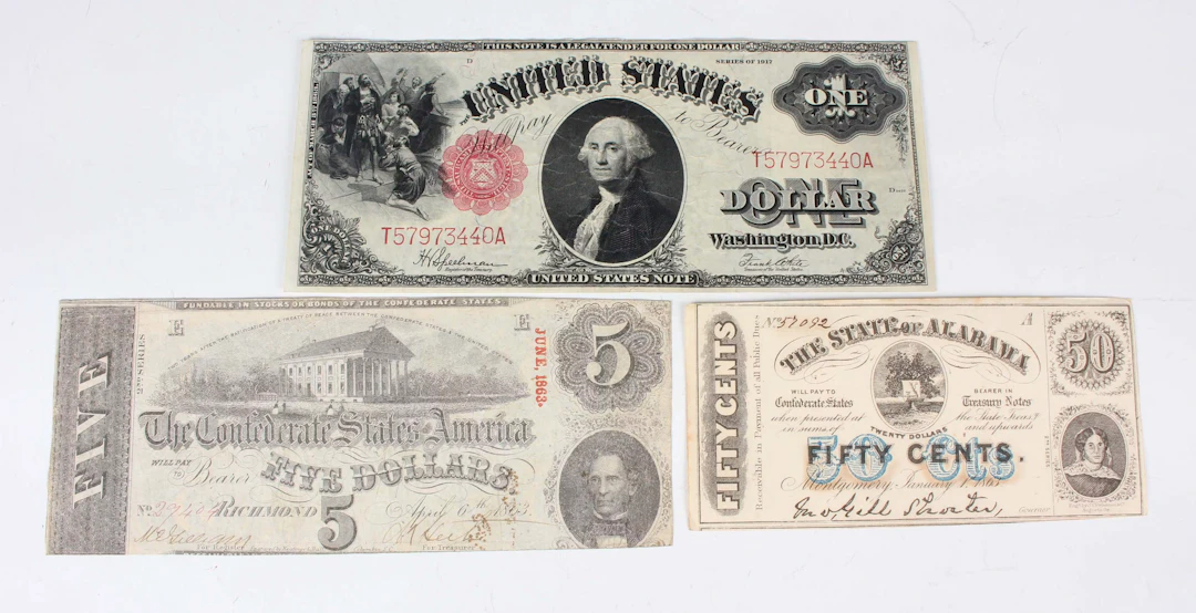A small group of USA banknotes, including a United States one dollar