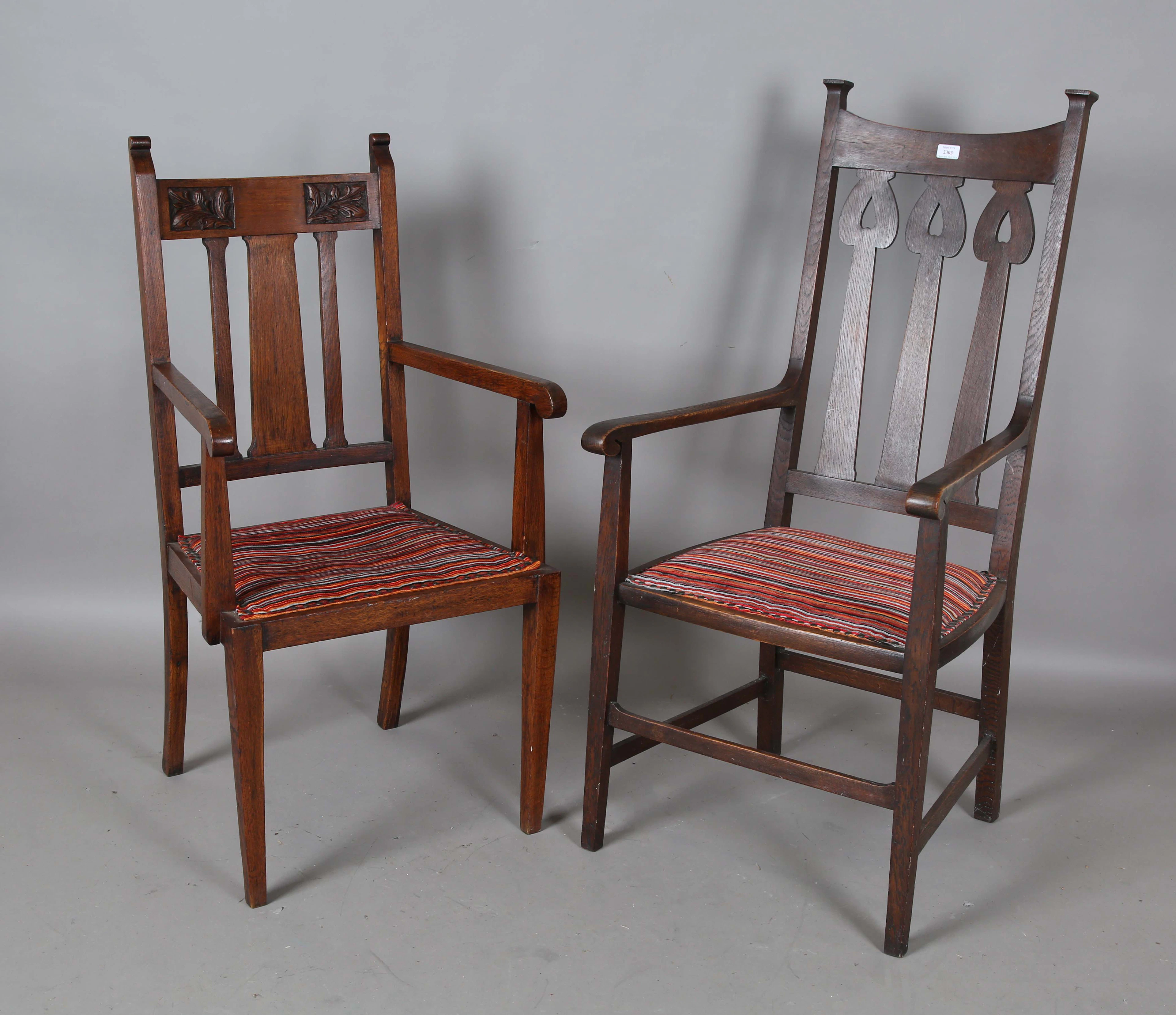 An Edwardian Arts and Crafts oak framed elbow chair, in the manner