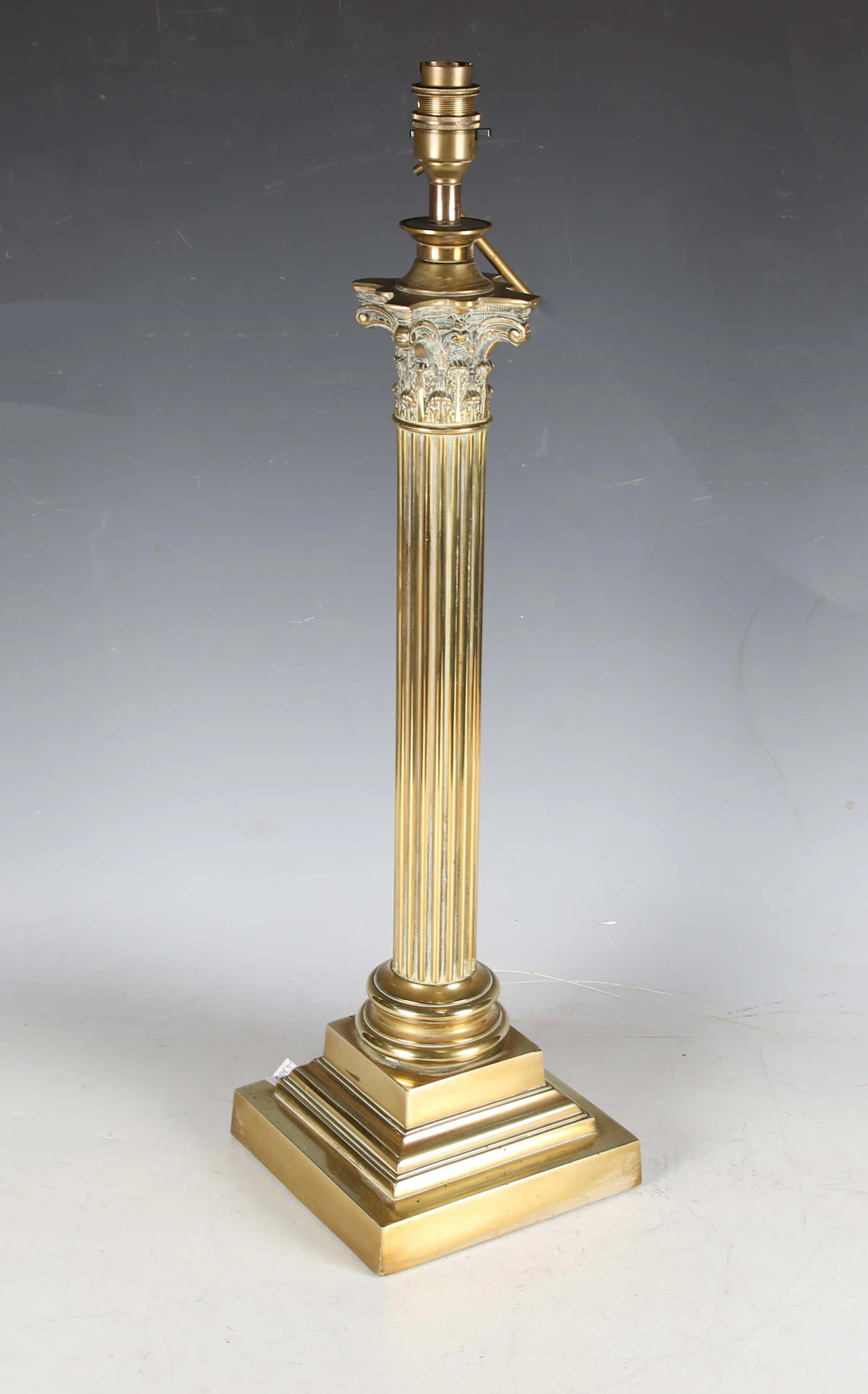 An Edwardian brass Corinthian column table lamp, converted to electricity