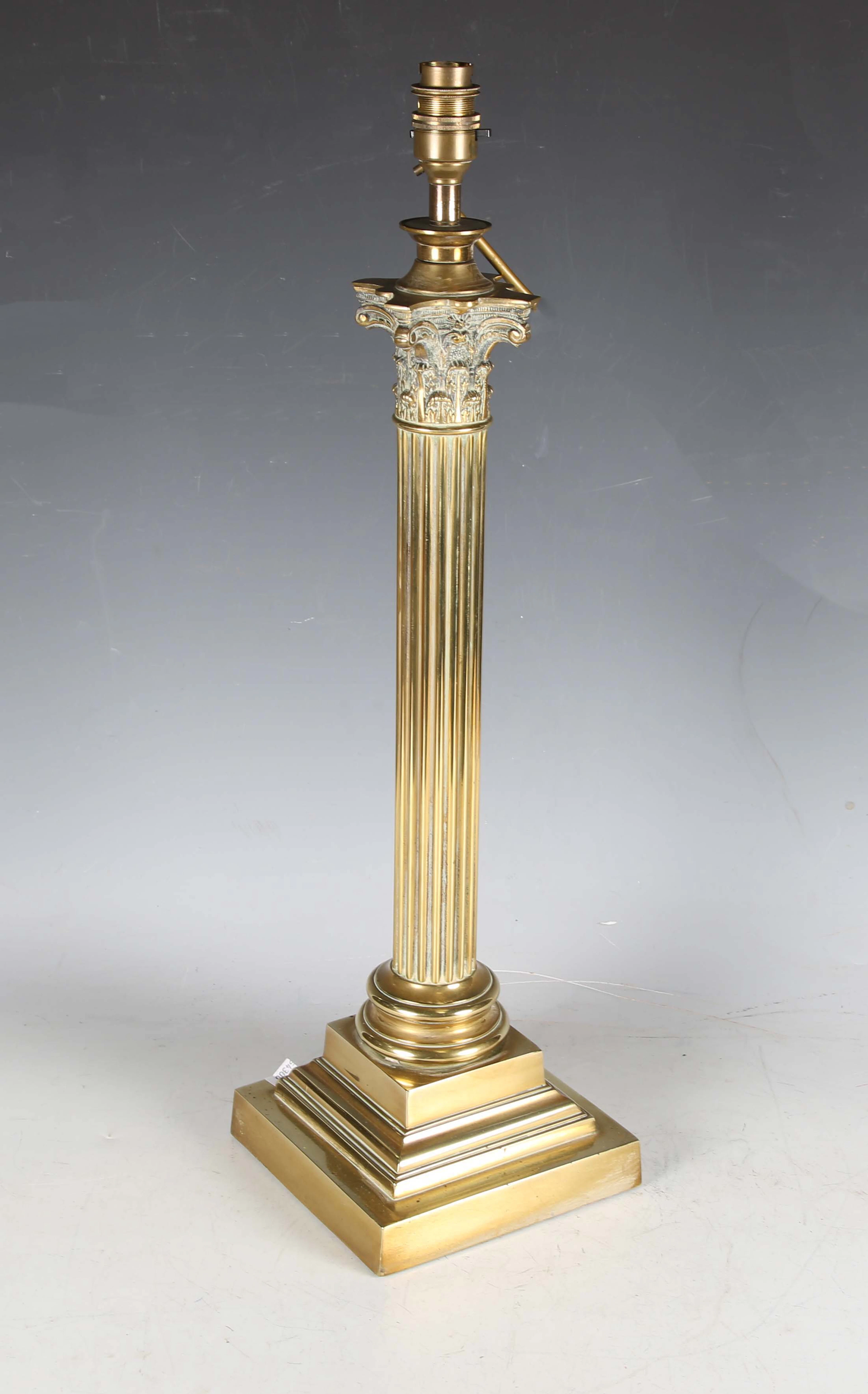 An Edwardian brass Corinthian column table lamp, converted to electricity