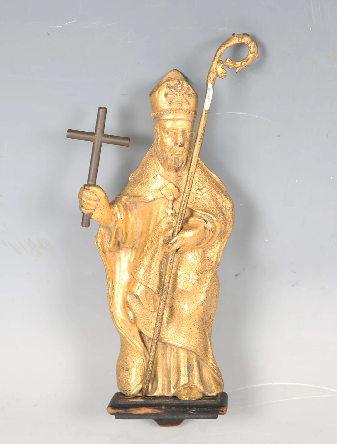 An 18th/19th century Continental gilt metal figure of a bishop holding