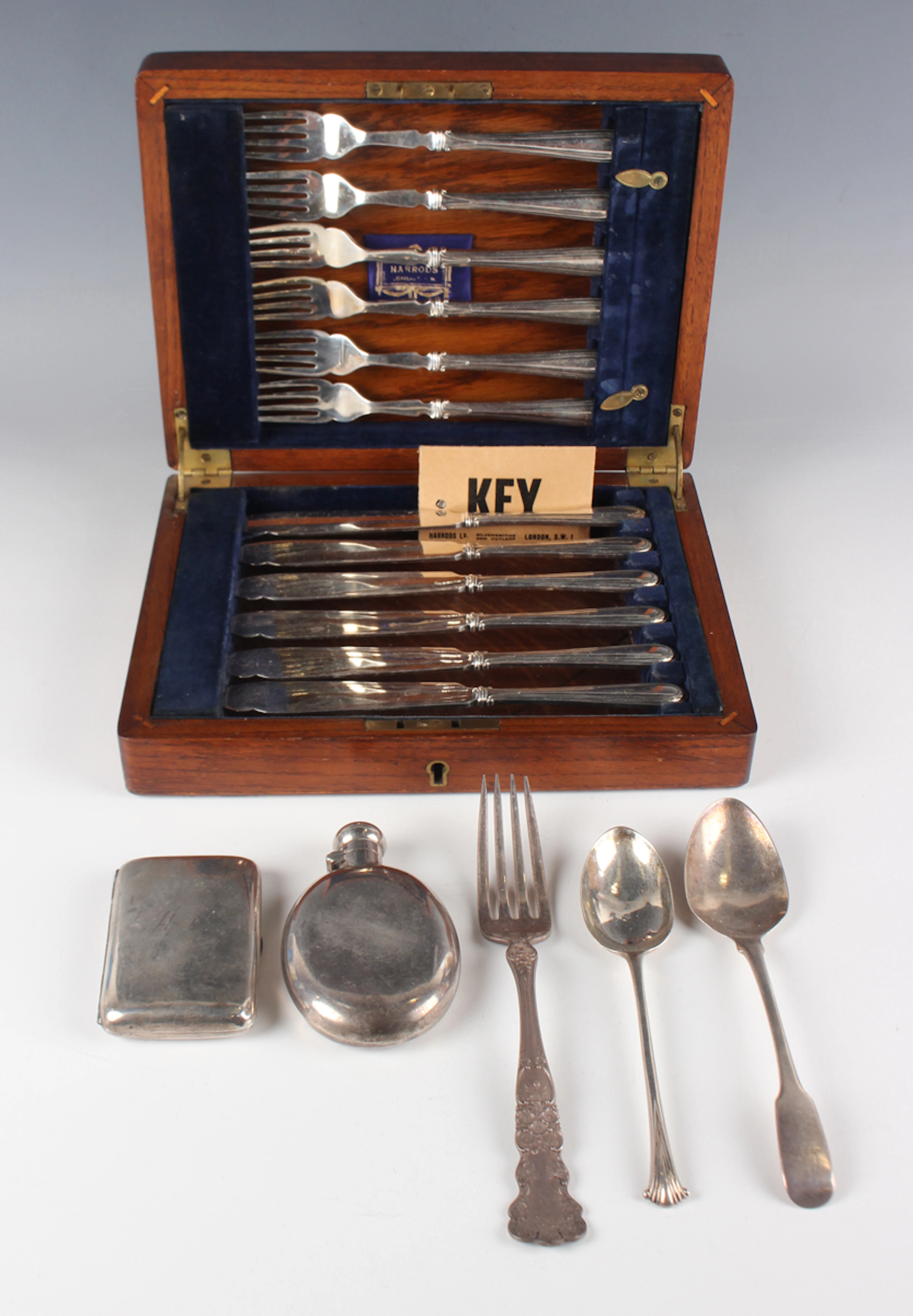 A small group of silver, including a late Victorian oval hip flask