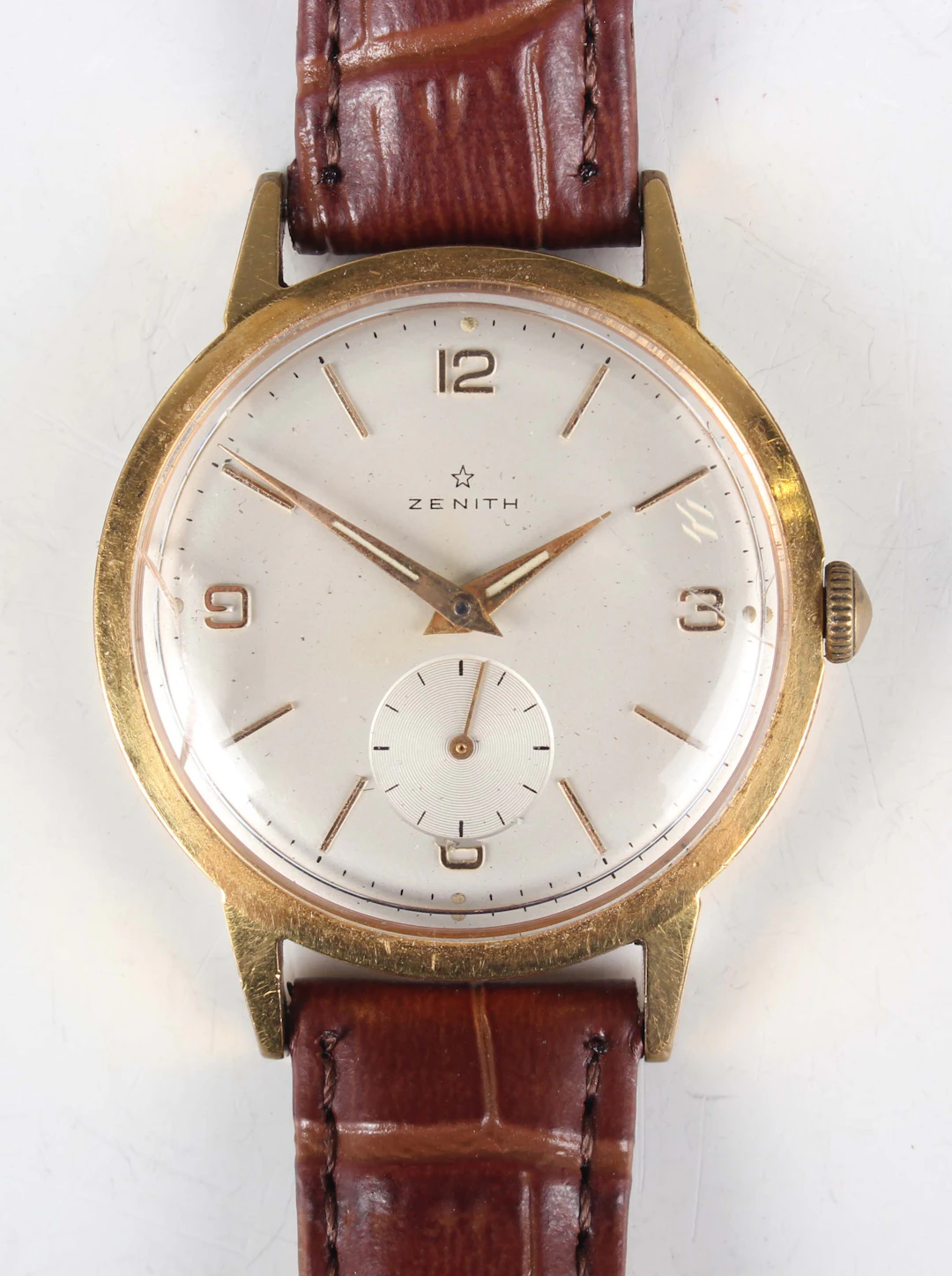 A Zenith gilt metal fronted and steel backed circular cased gentleman's