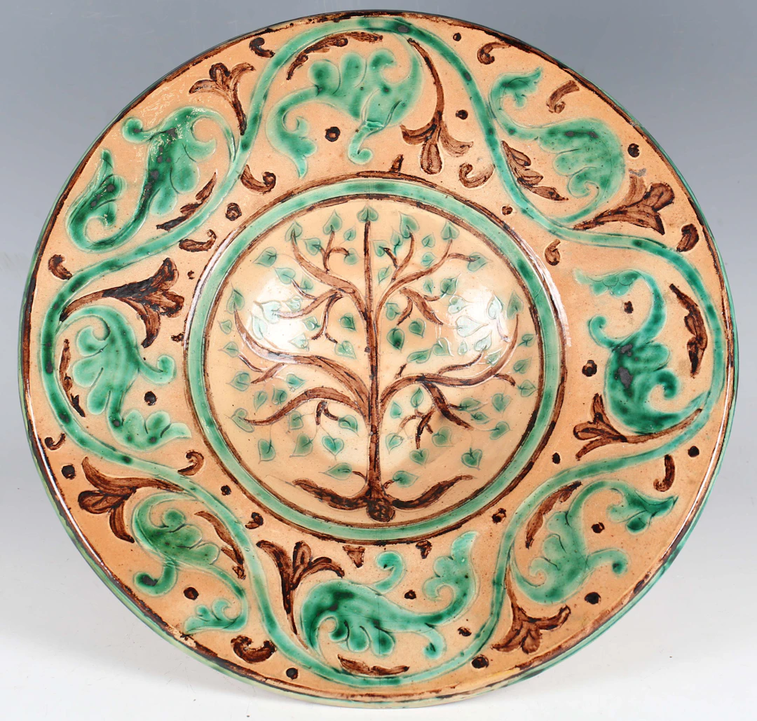 A Della Robbia pottery circular dish, circa 1890, the concave centre
