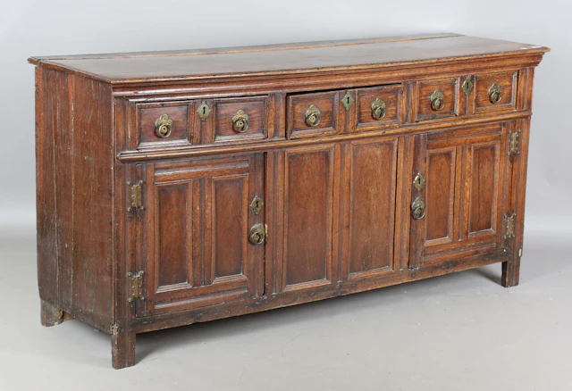 An early 18th century provincial oak dresser base, fitted with three