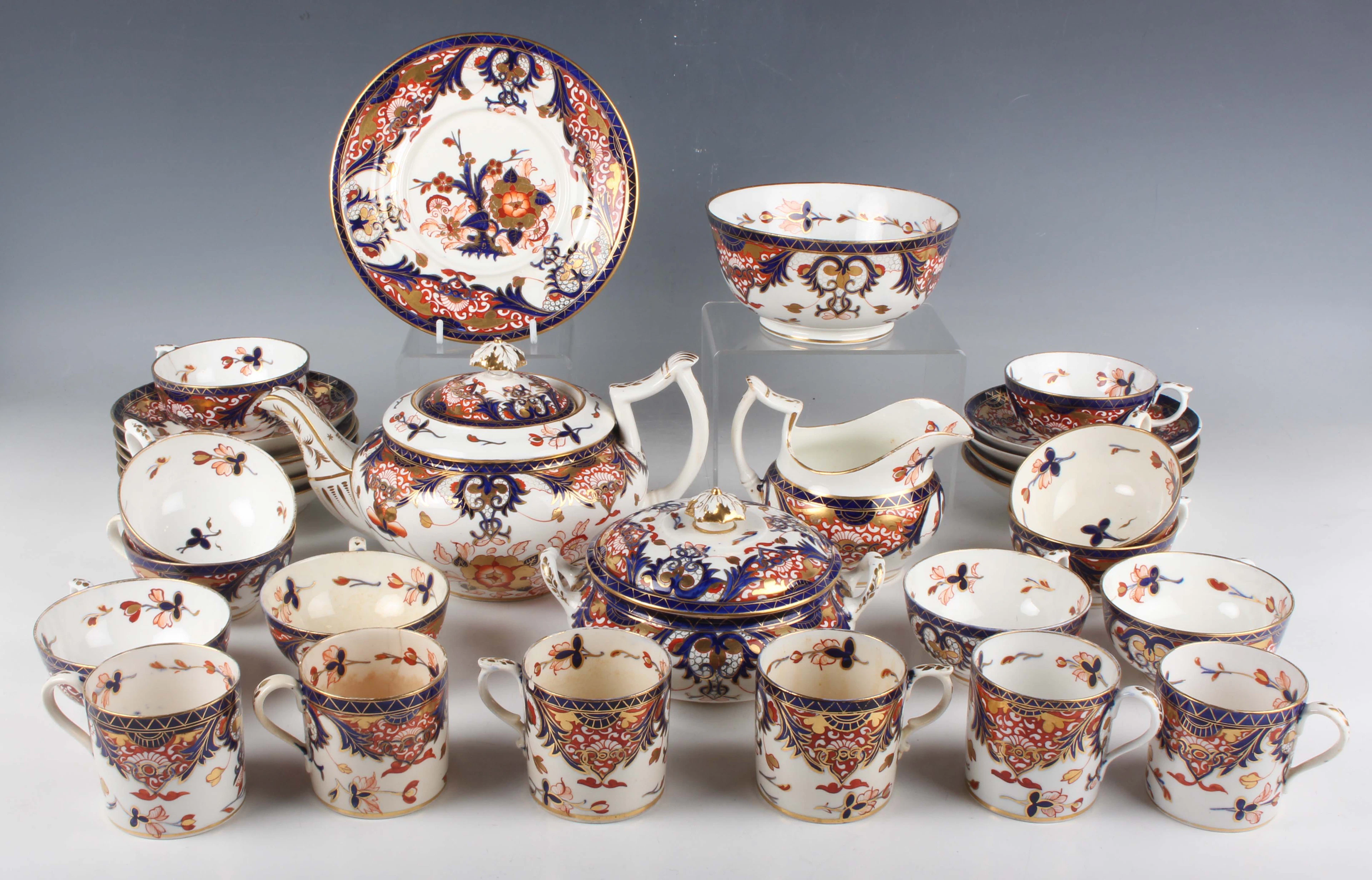 A matched Derby porcelain Imari decorated Japan pattern part service