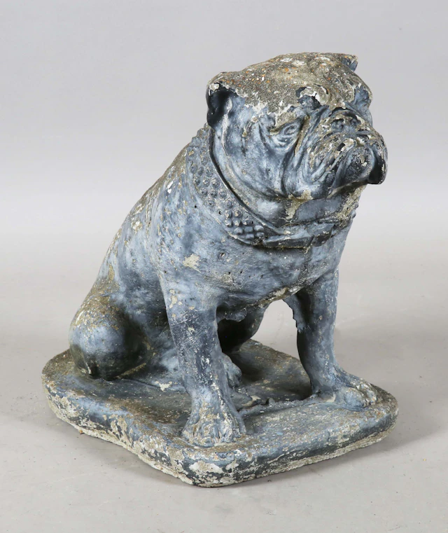 A 20th century cast composition stone garden model of a seated bulldog