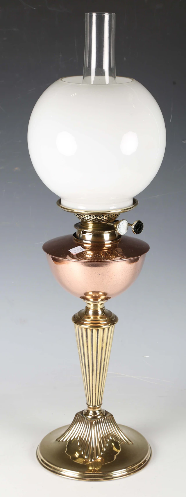 A late Victorian copper and brass table oil lamp, in the manner of