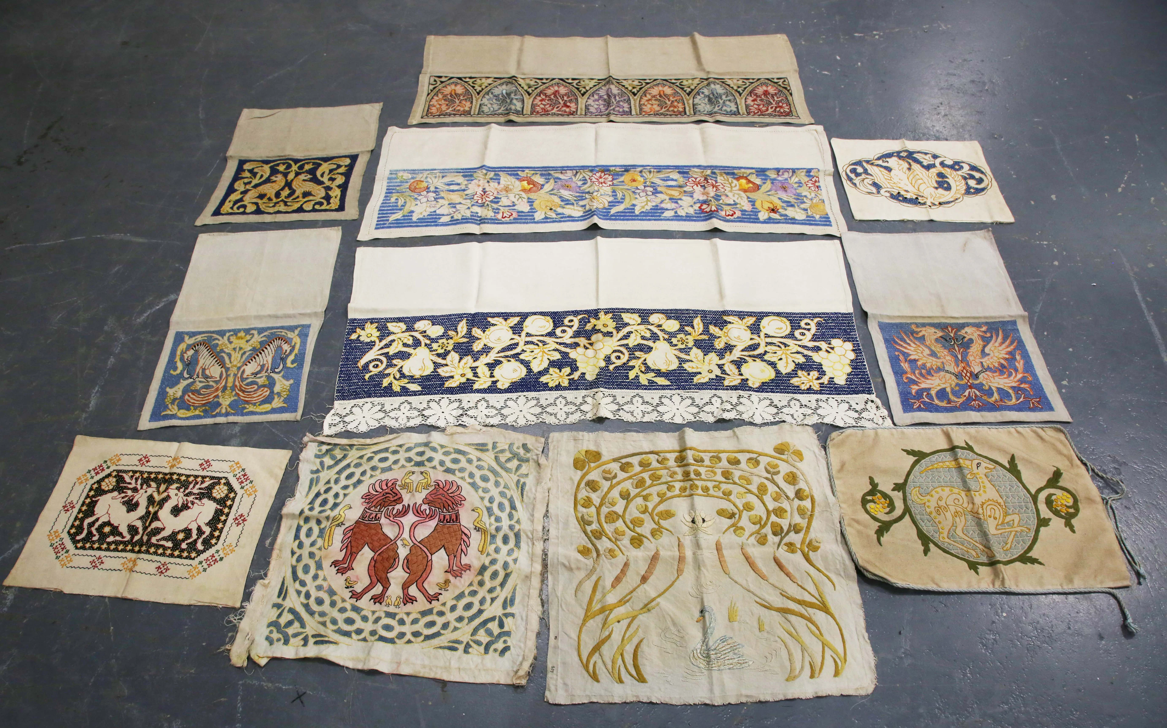 A group of five early 20th century Arts and Crafts embroidered linen