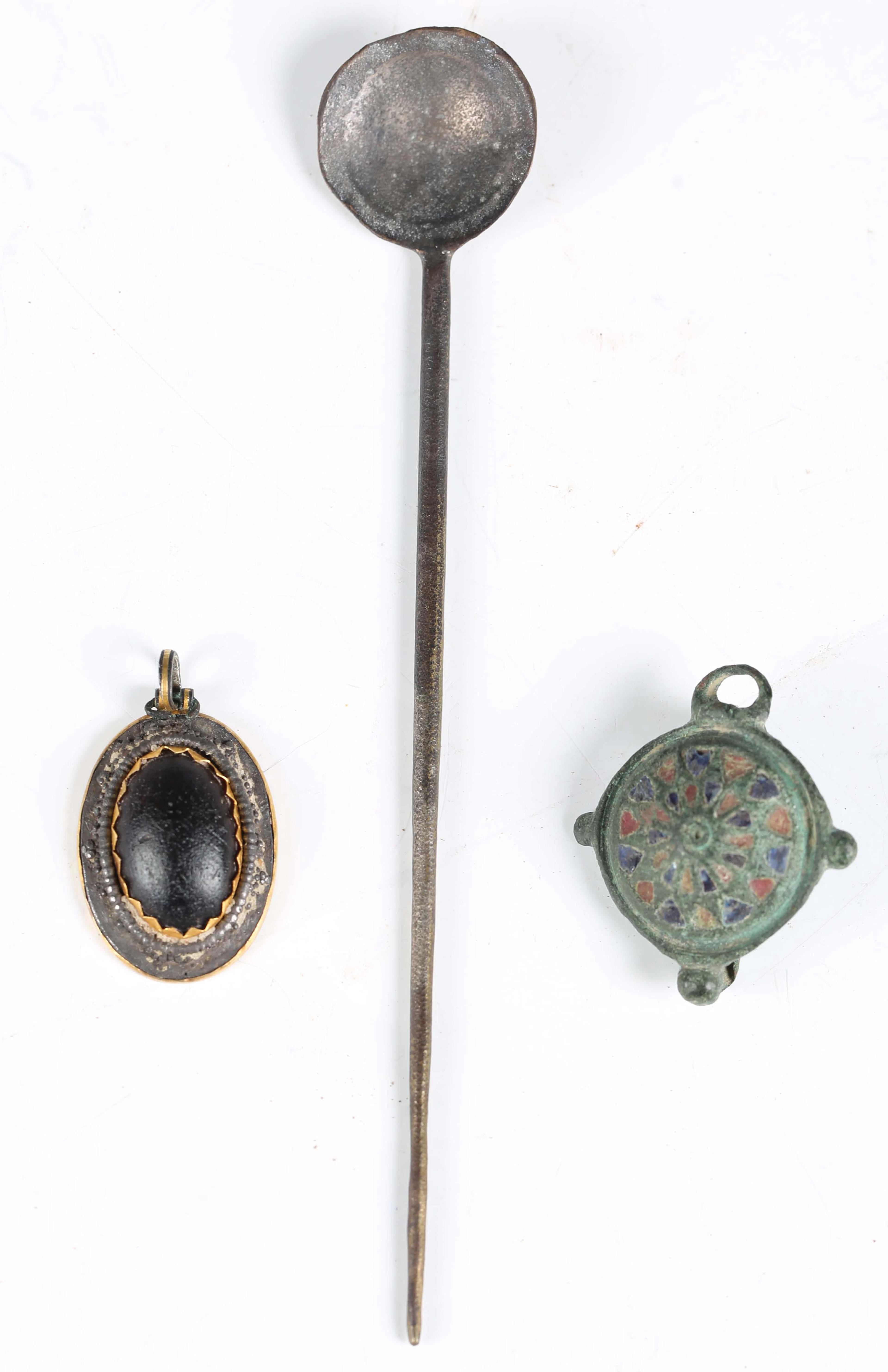 An ancient Roman copper alloy umbonate brooch, the central domed boss