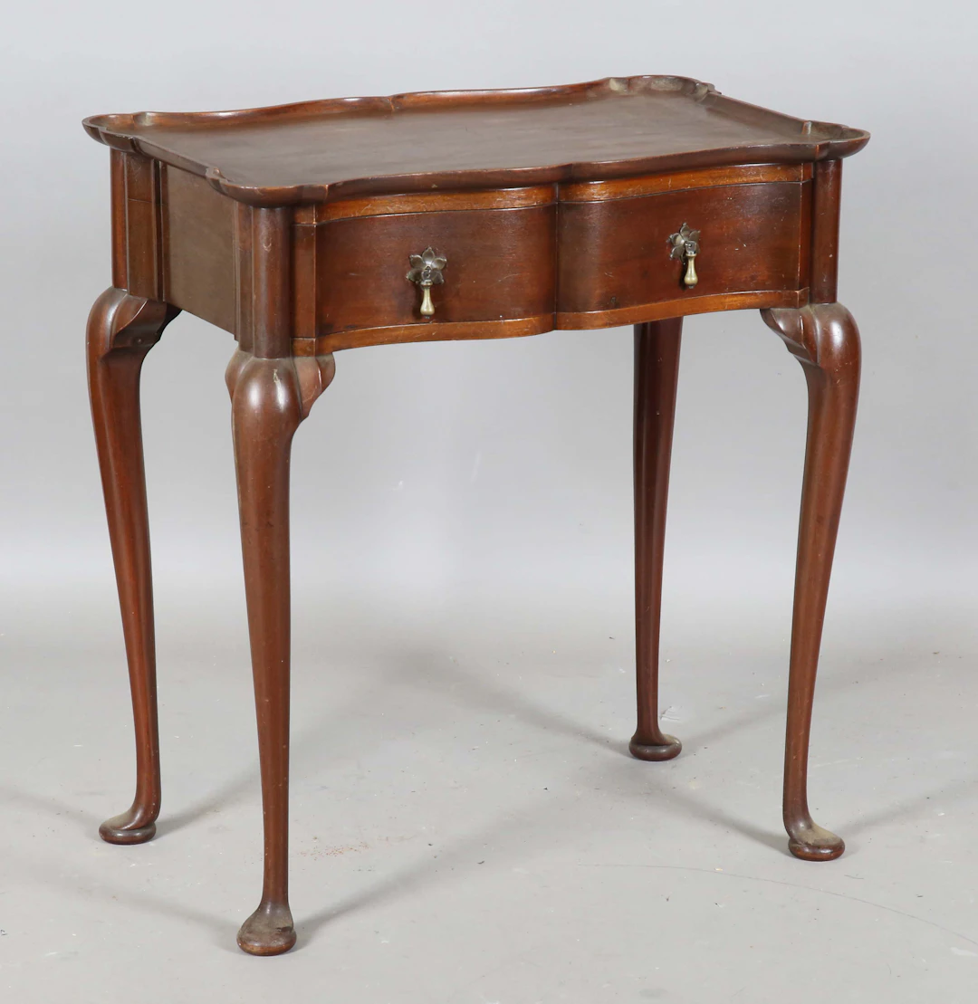 An early 20th century George II style mahogany silver table by John