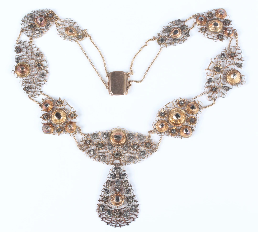A gold backed, silver set and diamond collar necklace, first quarter